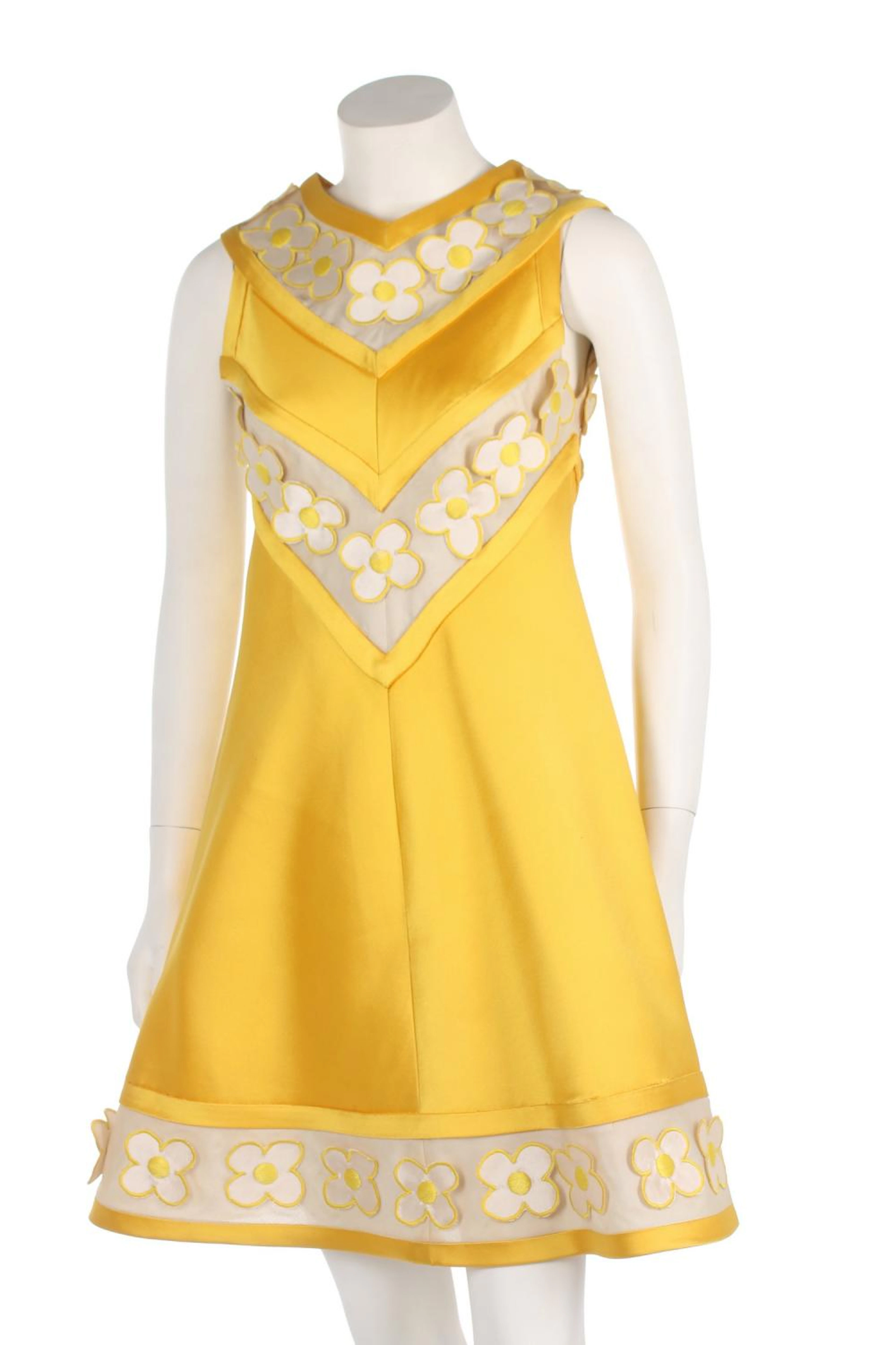 An André Courrèges yellow ziberline mini-dress, 1968, unlabelled, the inset