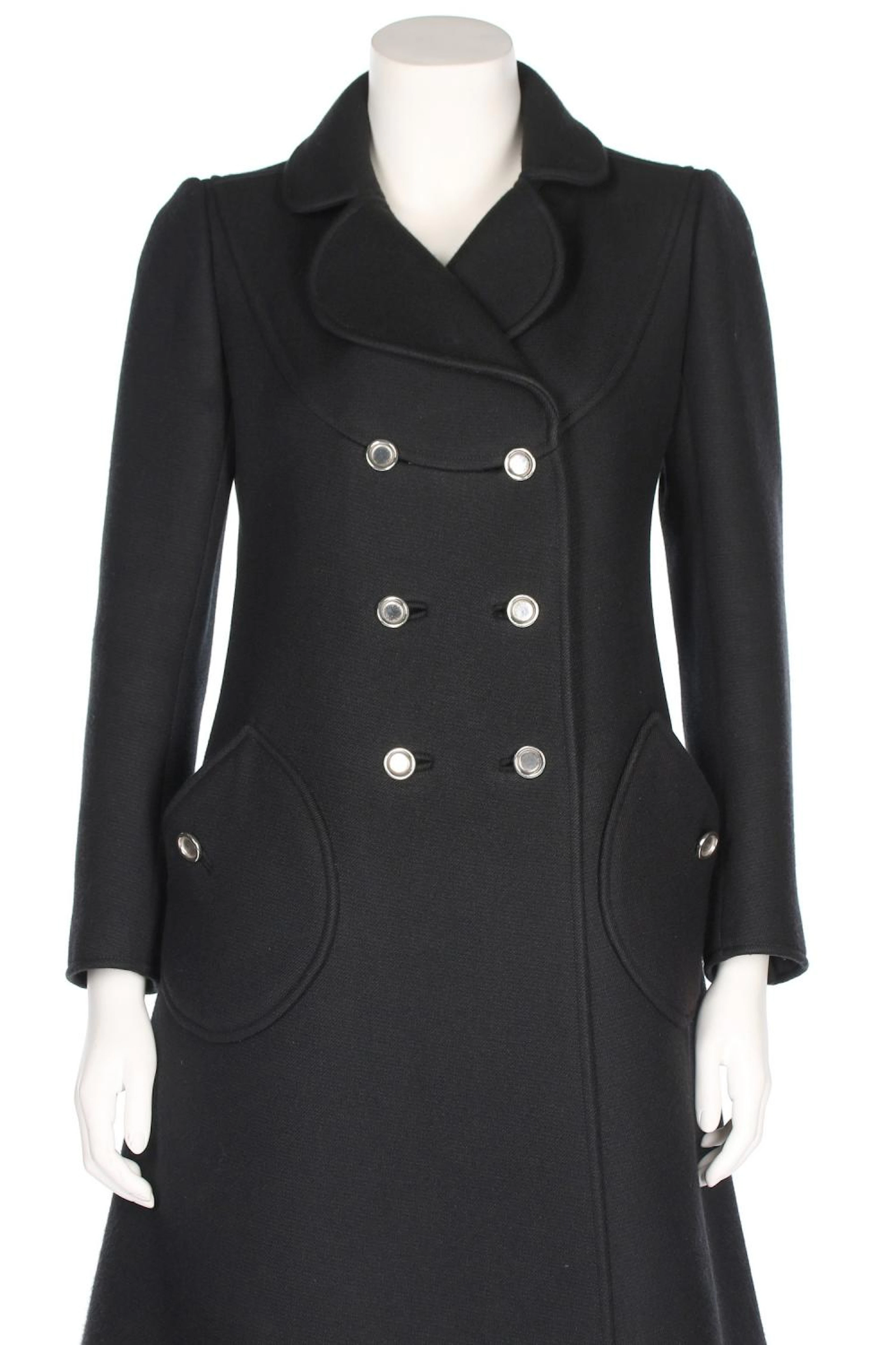 An André Courrèges black wool coat, circa 1969, Paris labelled, additional