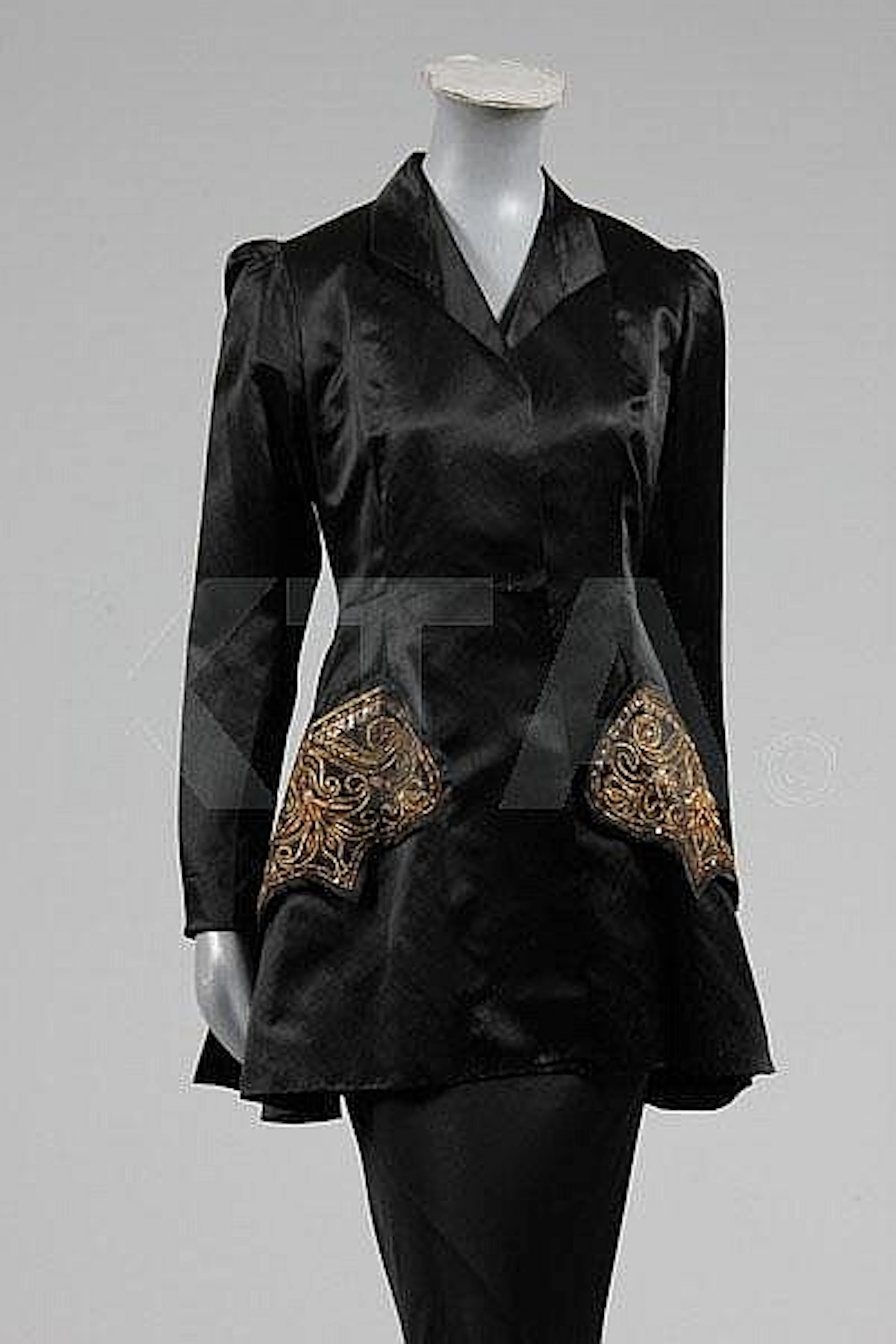 A Mainbocher couture black satin evening jacket,