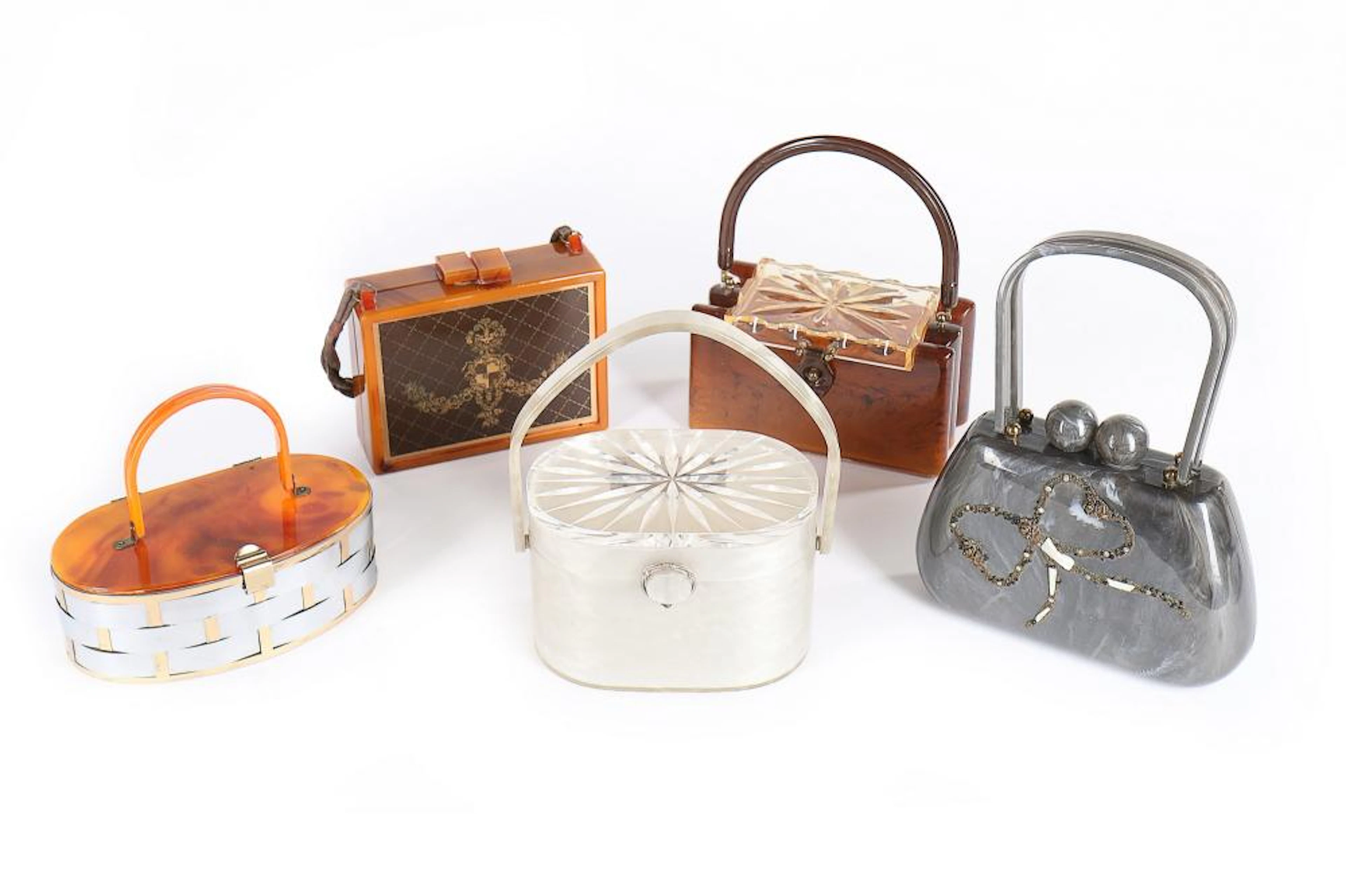 Five Lucite handbags, late 1940s-50s, including one by Wilardy of faux moth