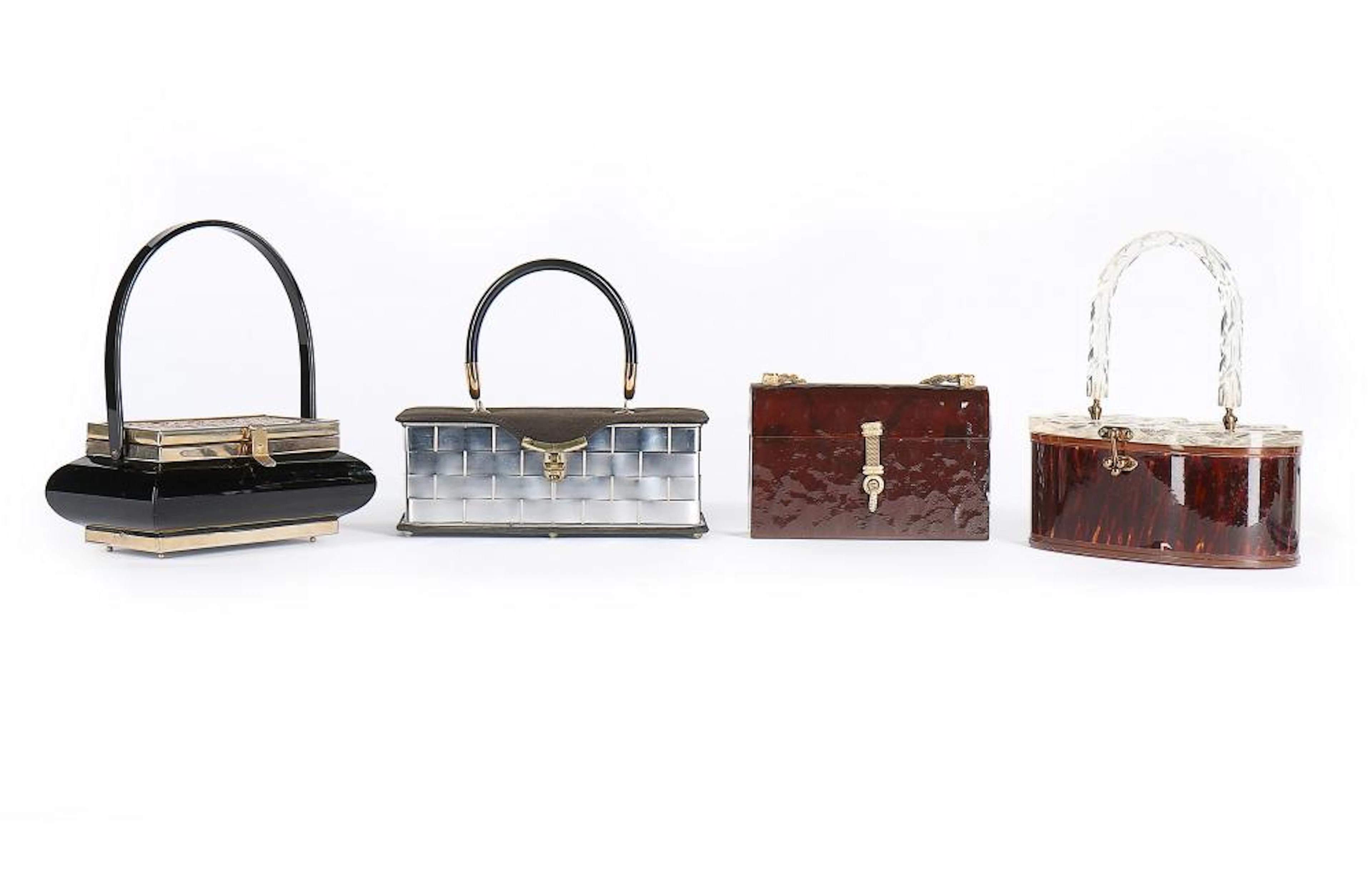Four Lucite handbags in dark shades, late 1940s-50s, including oriental ins