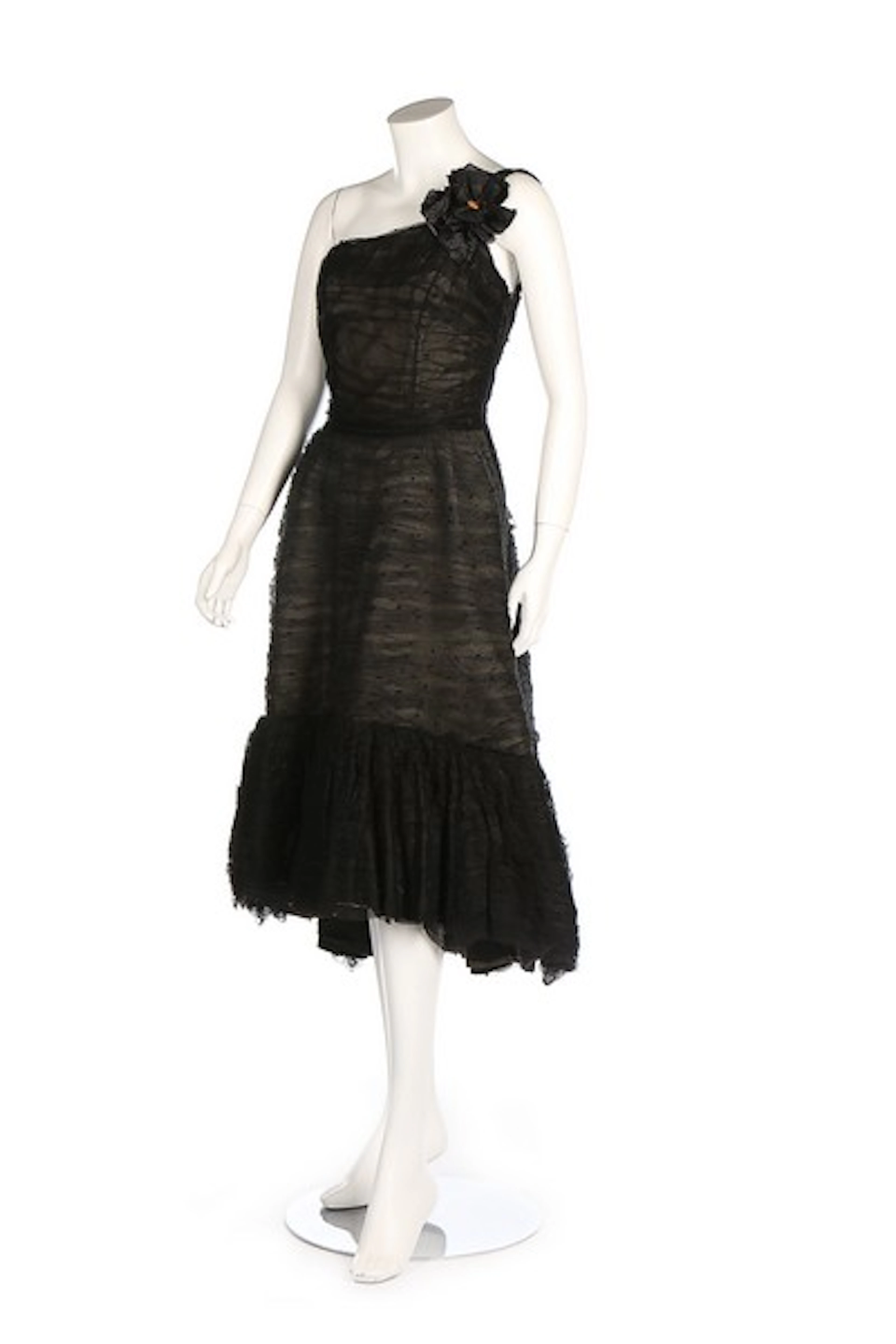 A general group of evening wear, mainly black and white, dating from the 19