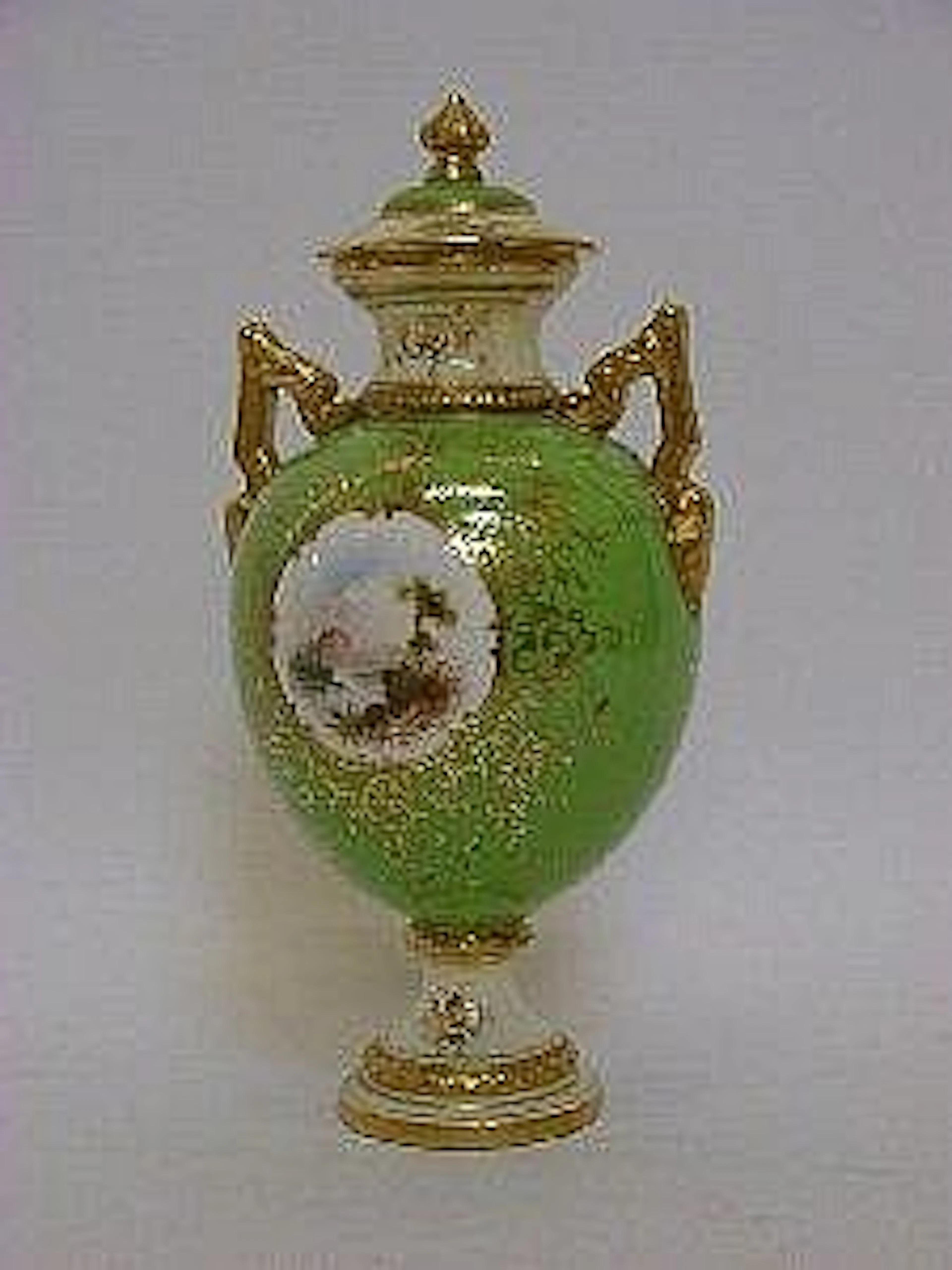 A COALPORT TWIN HANDLED BALUSTER VASE AND COVER
