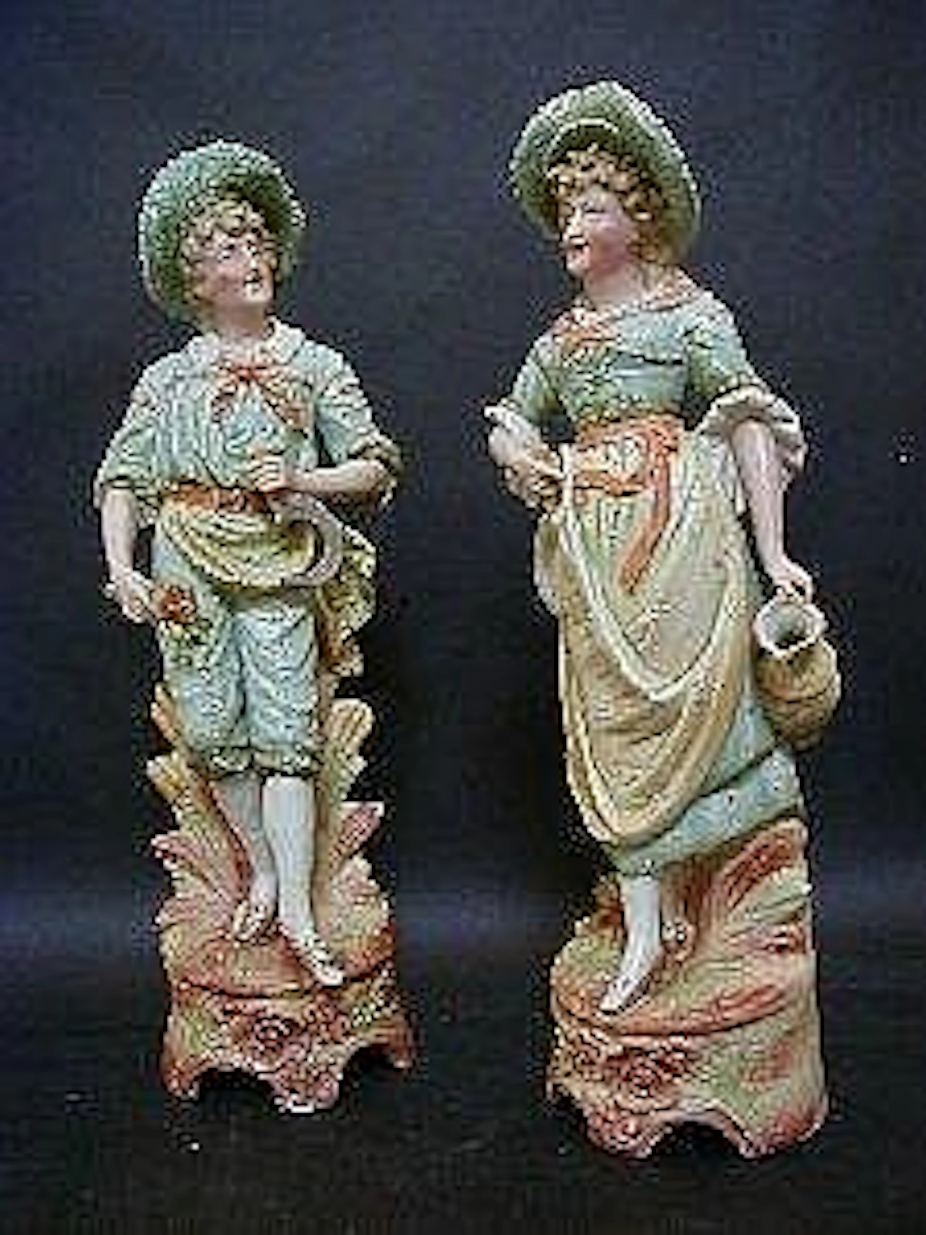A PAIR OF TINTED BISQUE FIGURES