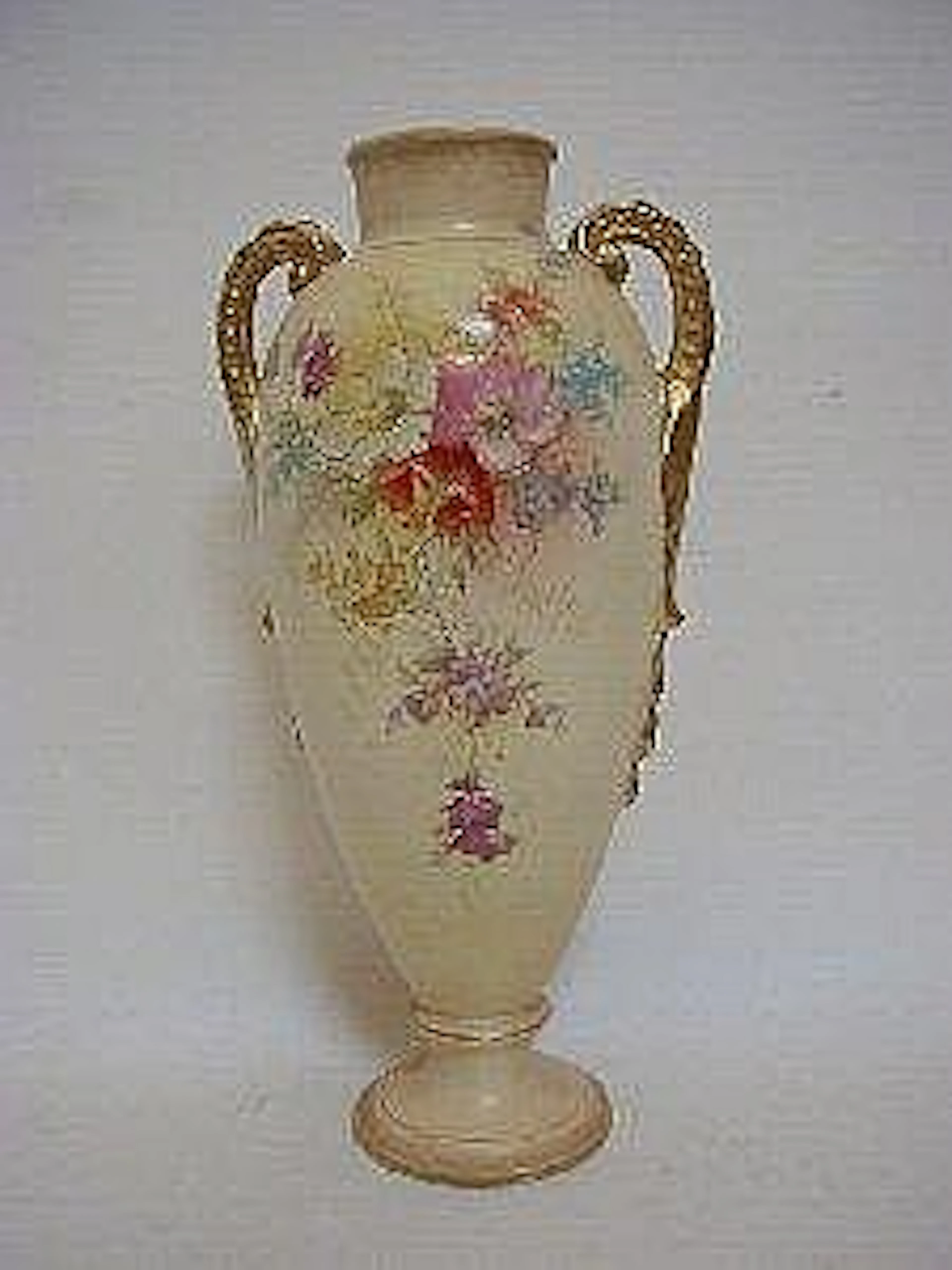 A ROYAL BONN BLUSH IVORY TWIN HANDLED BALUSTER VASE