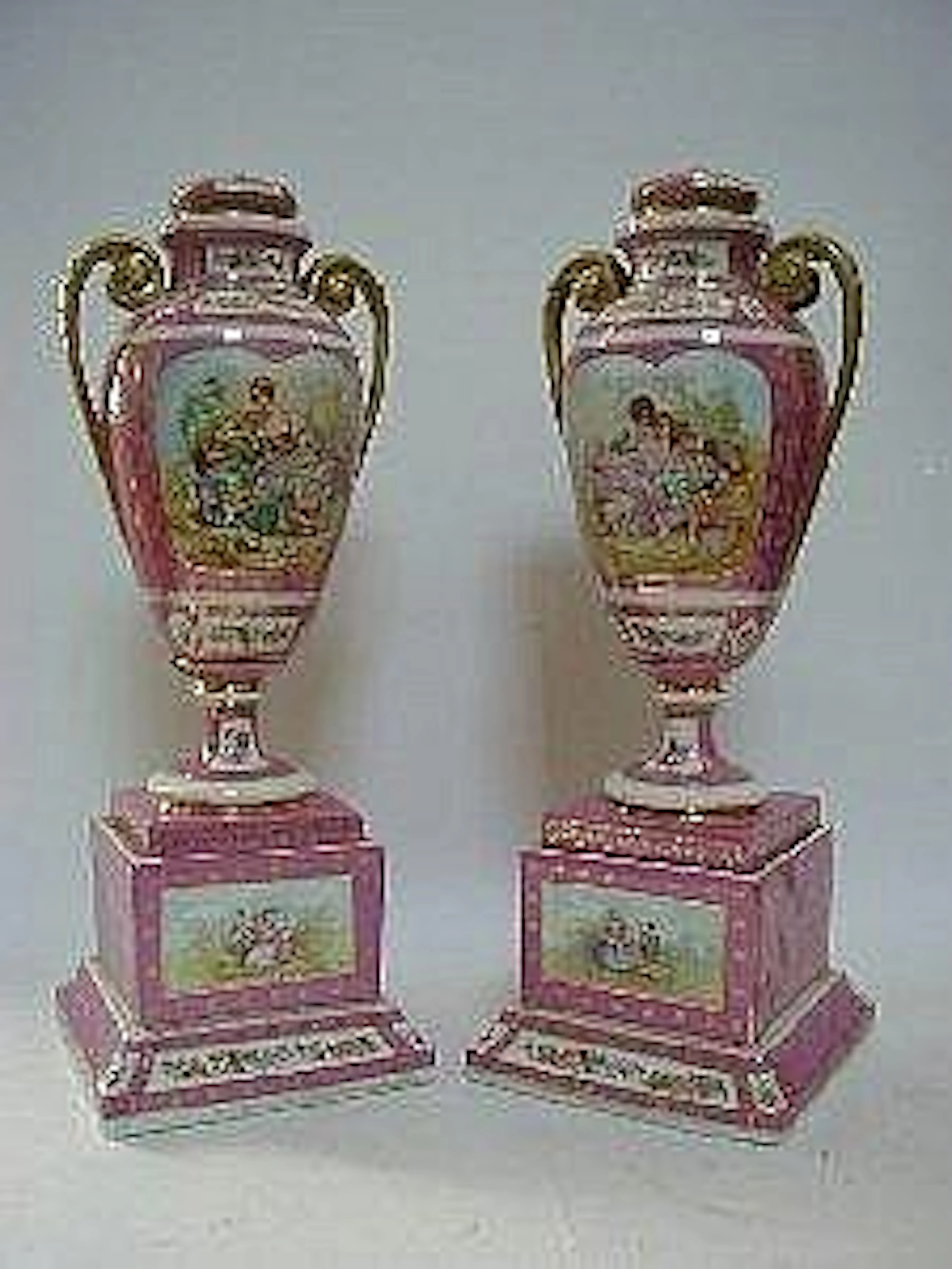 A PAIR OF URNS