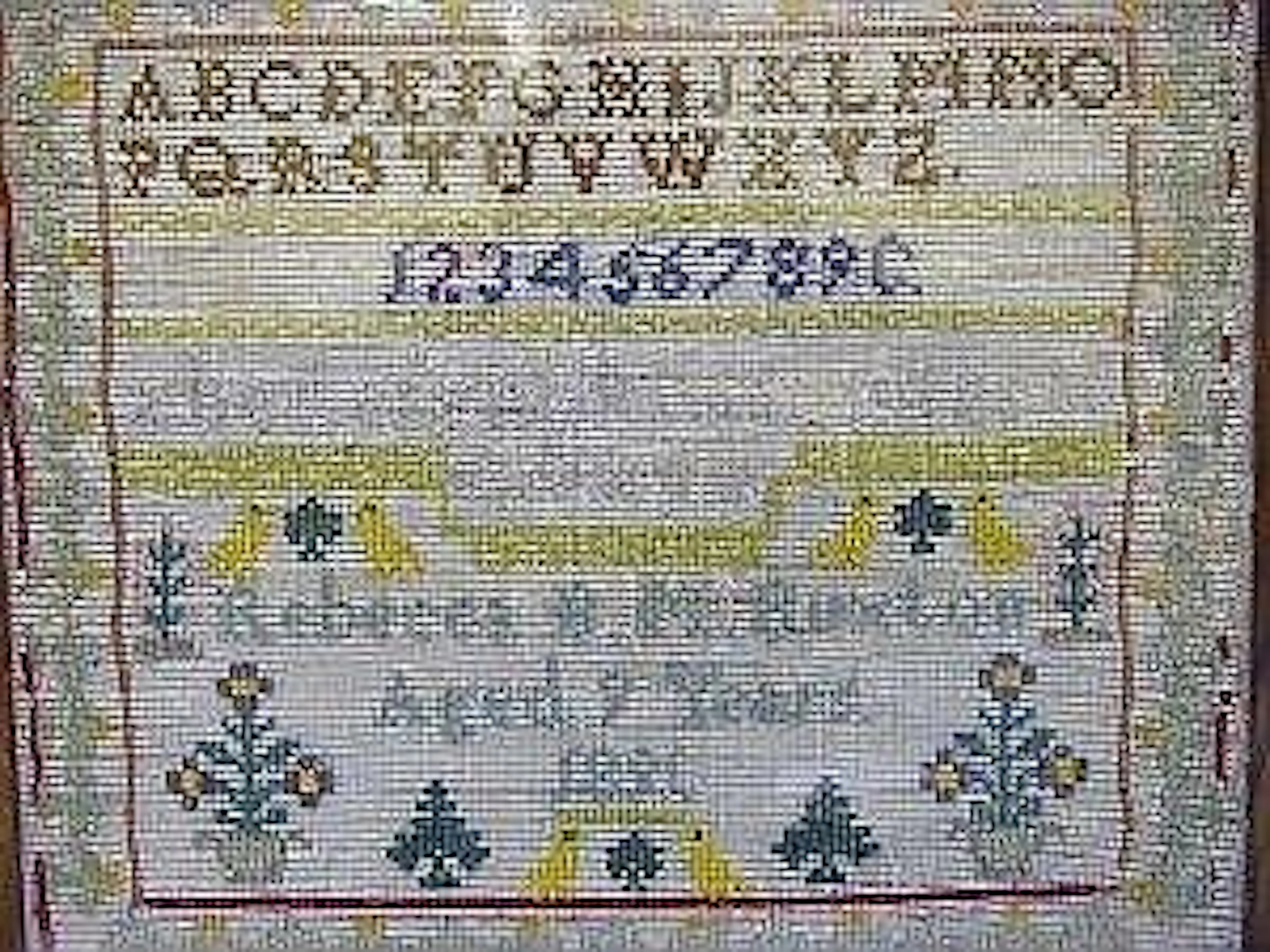 A WOOLWORK SAMPLER
