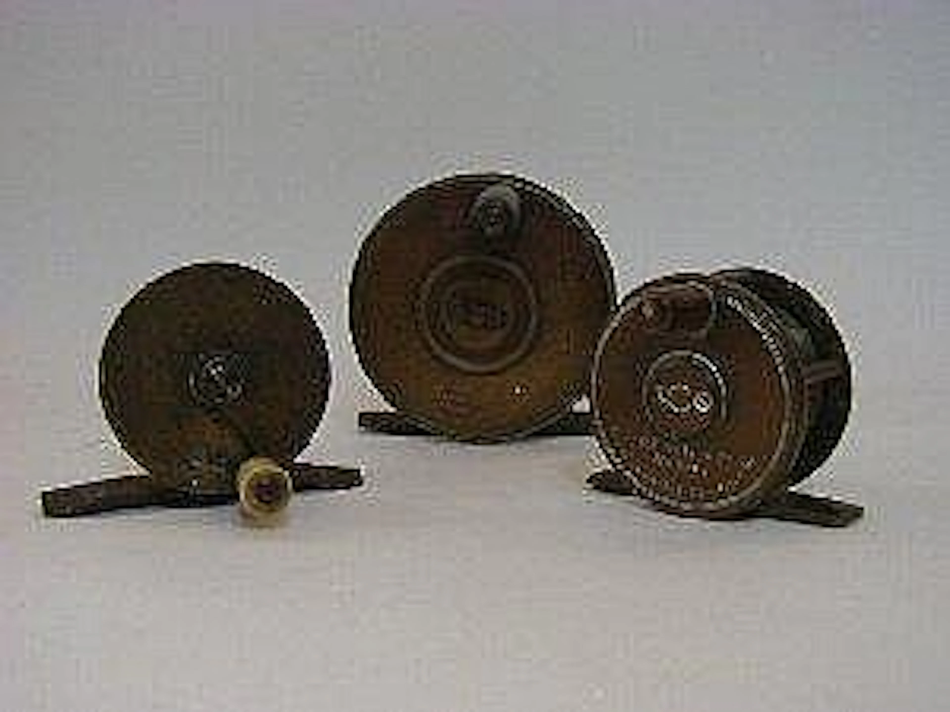 THREE BRASS FISHING REELS