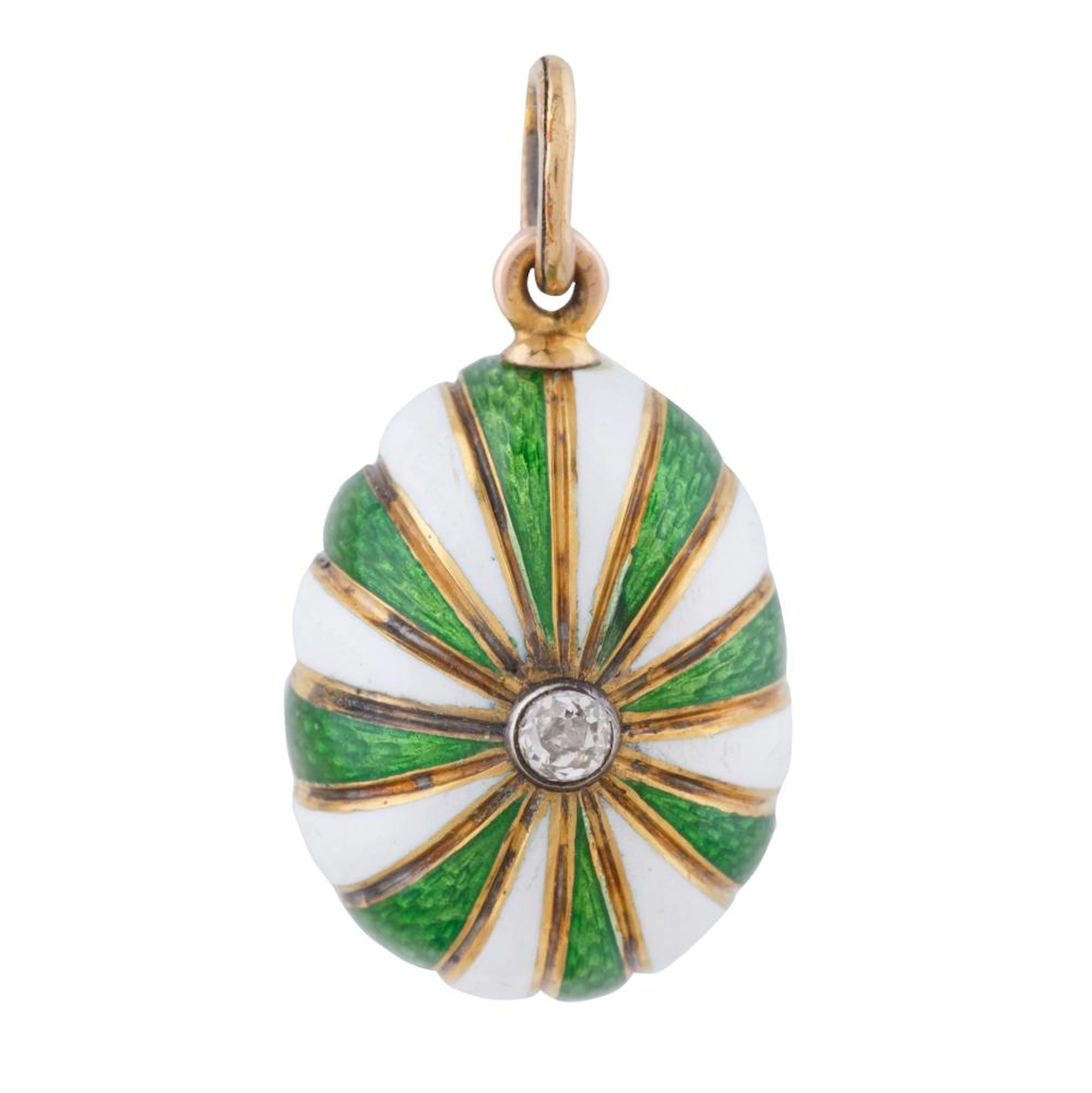 A FABERGE GOLD AND ENAMEL EGG PENDANT BY HENRIK WIGSTROM