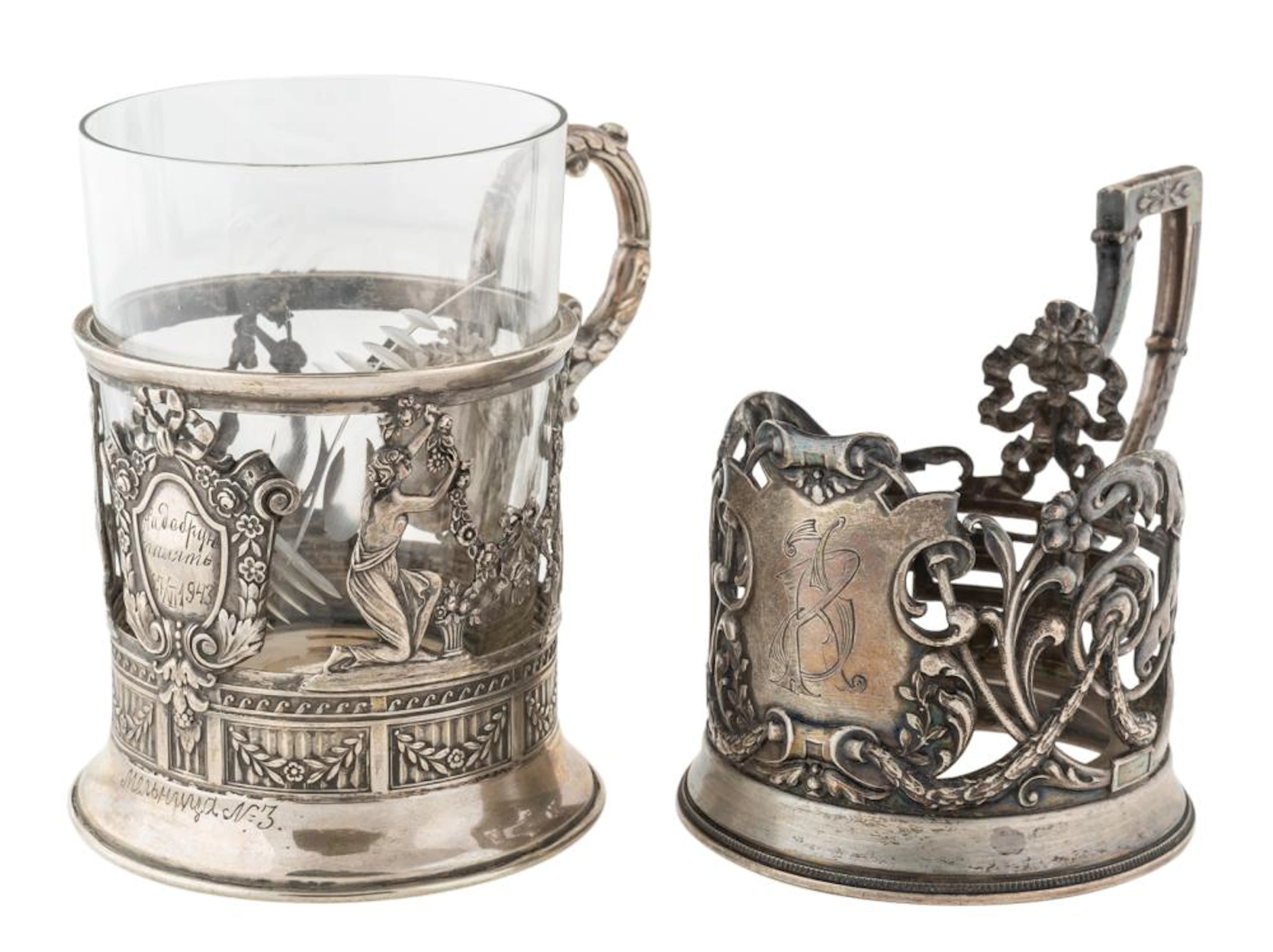 A PAIR OF RUSSIAN SILVER PODSTAKANNIKI