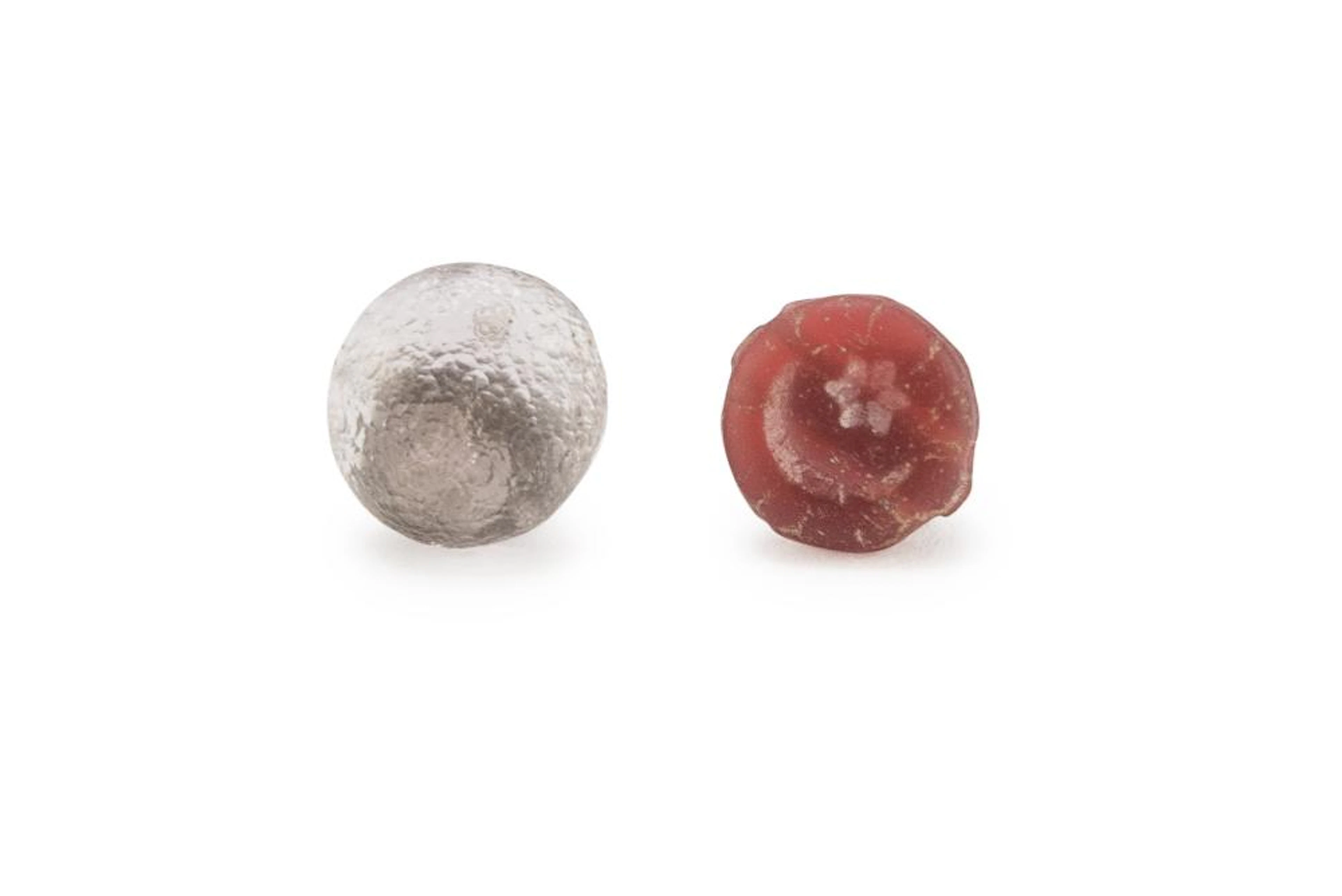A CARNELIAN AND A PEARL IN GLASS PASTE ROMAN AGE 1ST ? 2ND CENTURY