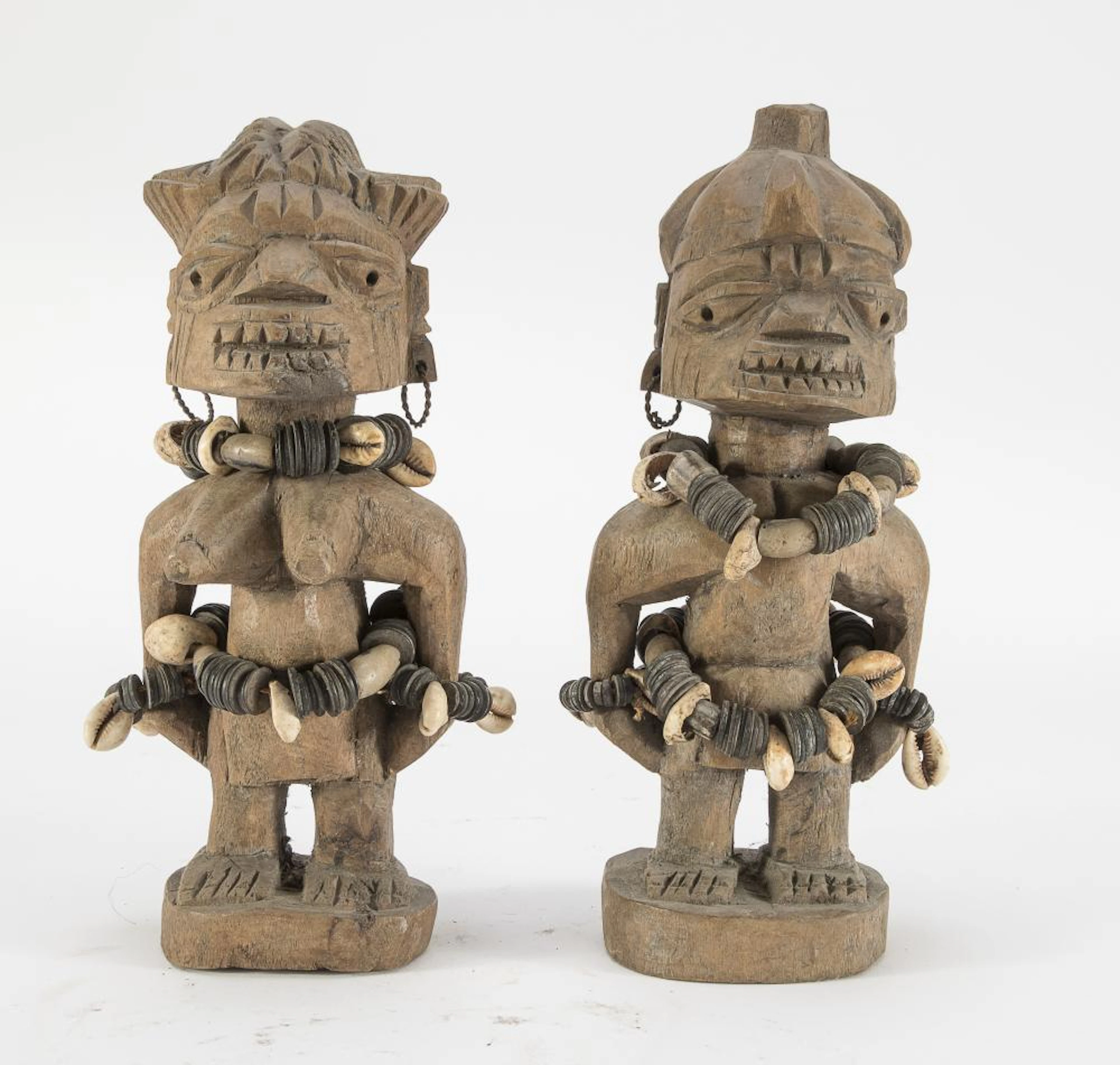 A YOMBÈ WOODEN SCULPTURES DEPICTING A COUPLE OF ANCESTORS CONGO 20TH CENTURY.