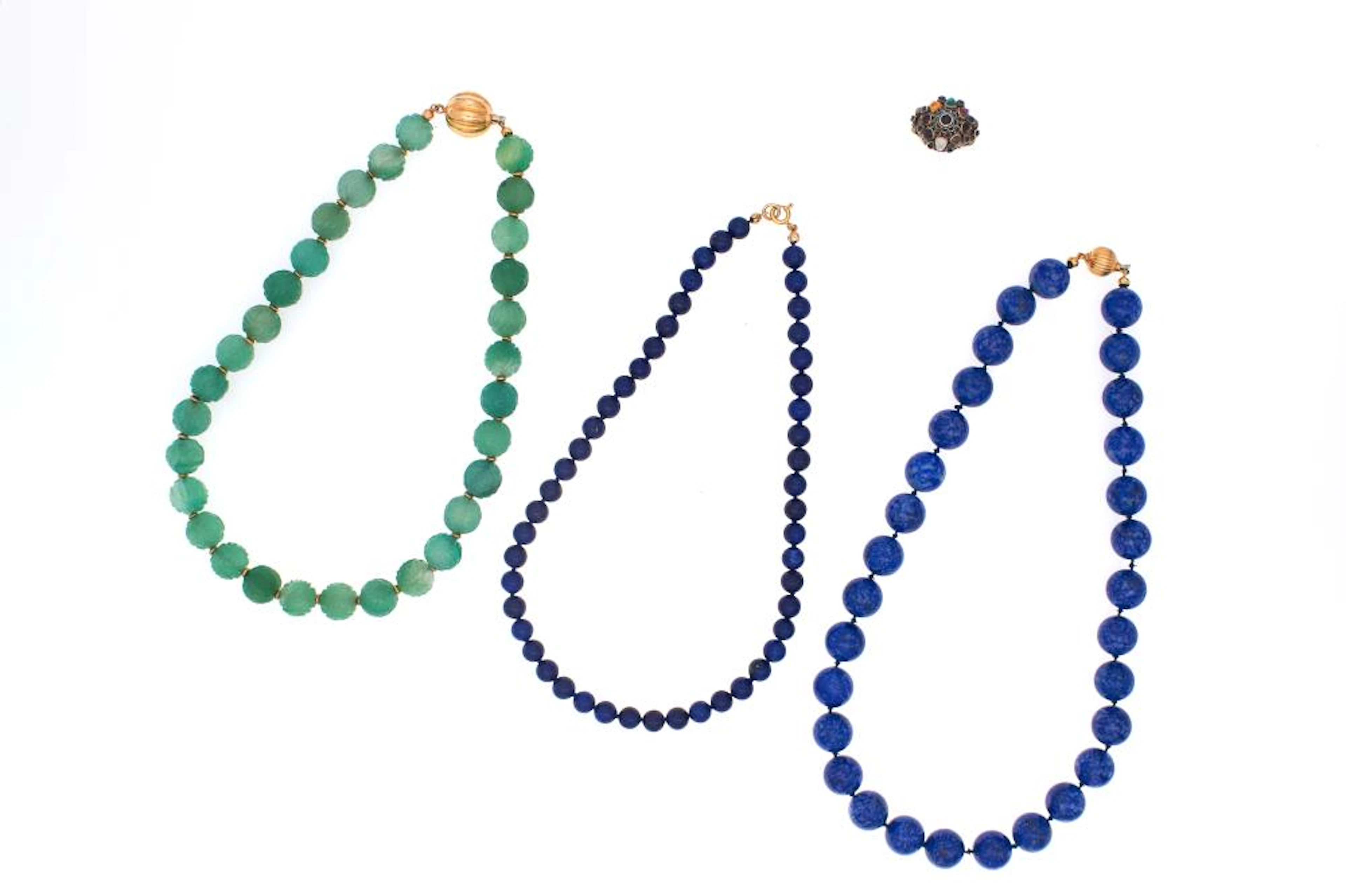 lot of three necklaces and a ring