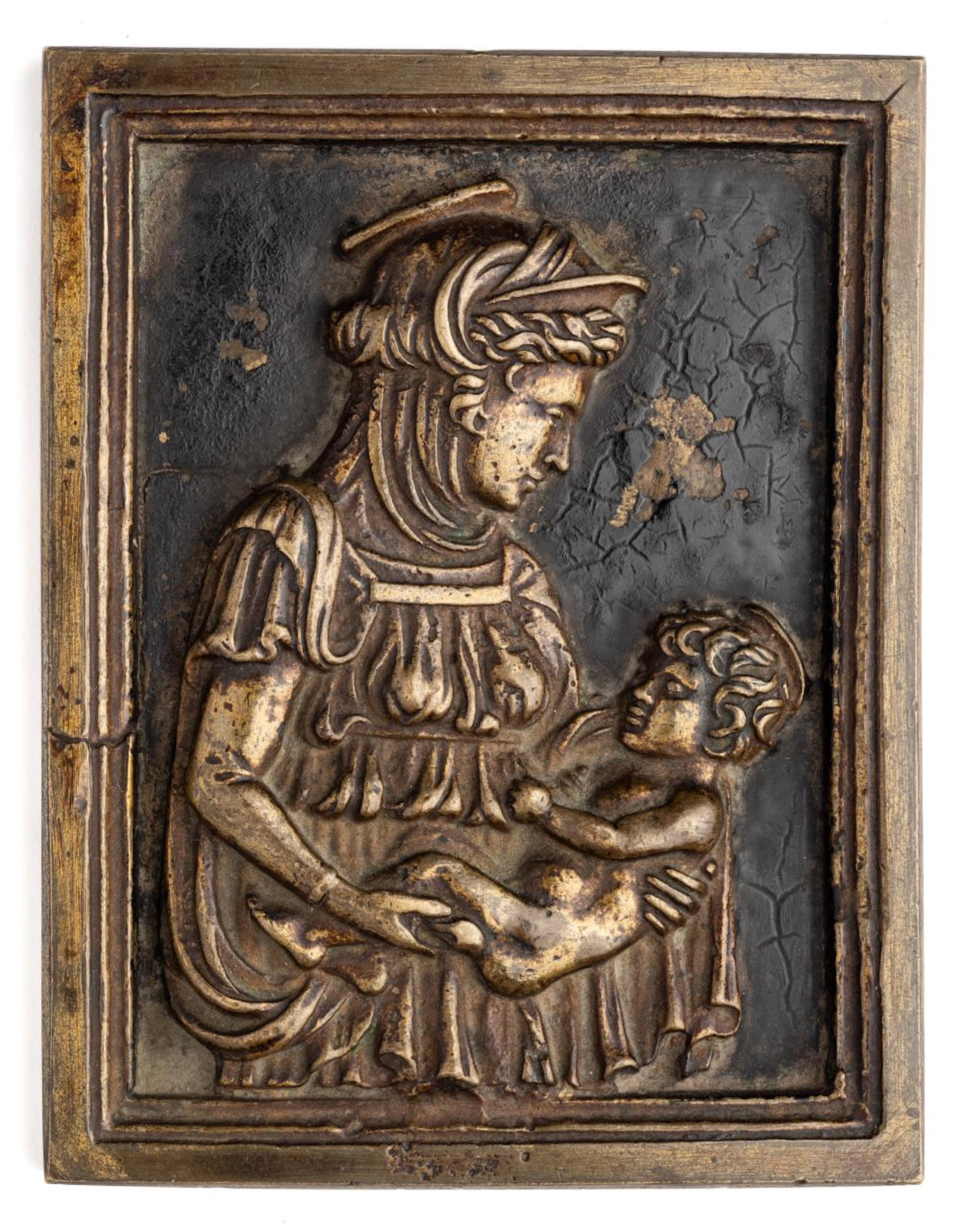? A BRONZE PLAQUETTE OF THE VIRGIN AND CHILD