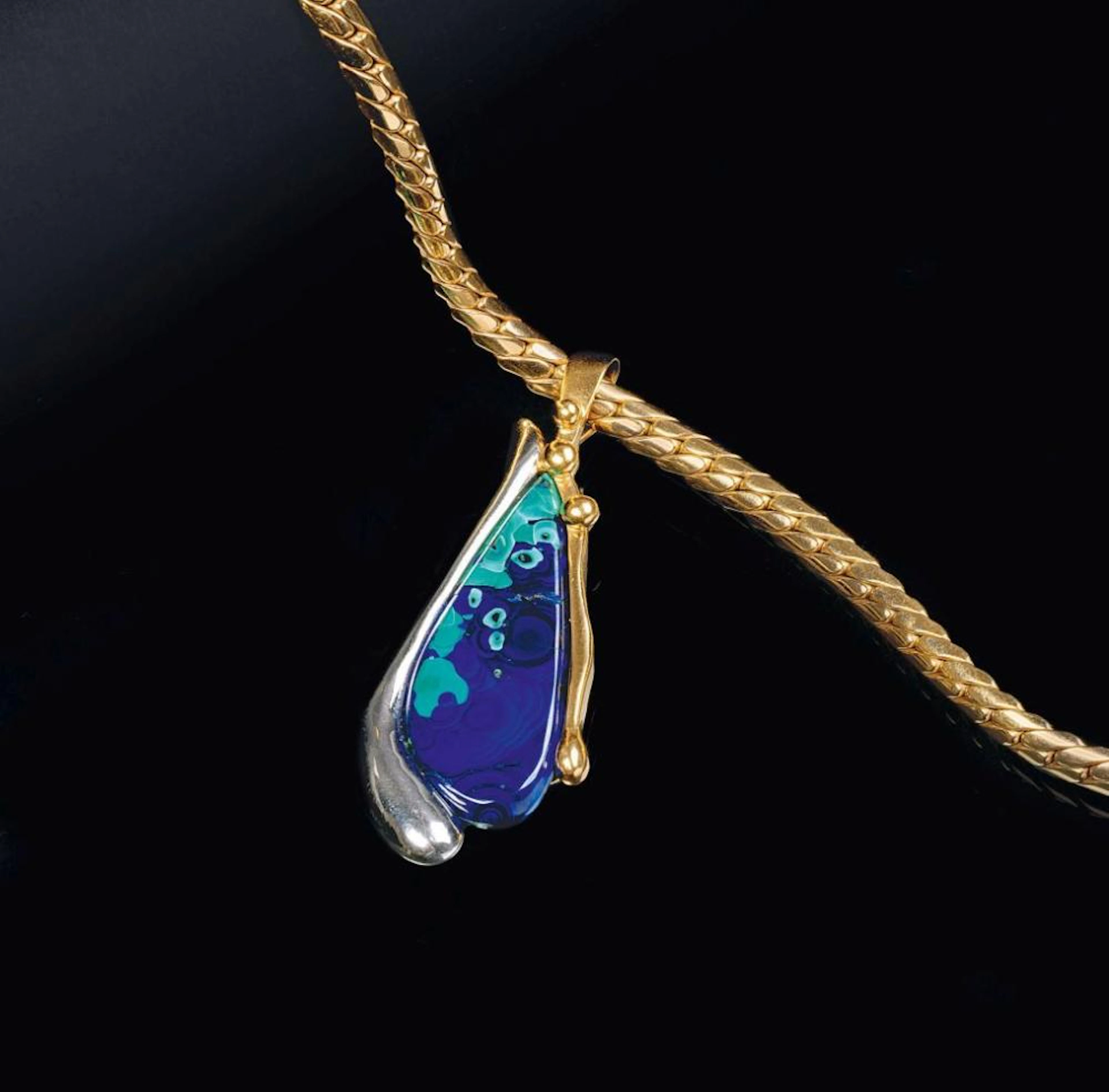 An Azurite Malachite Pendant on Necklace.