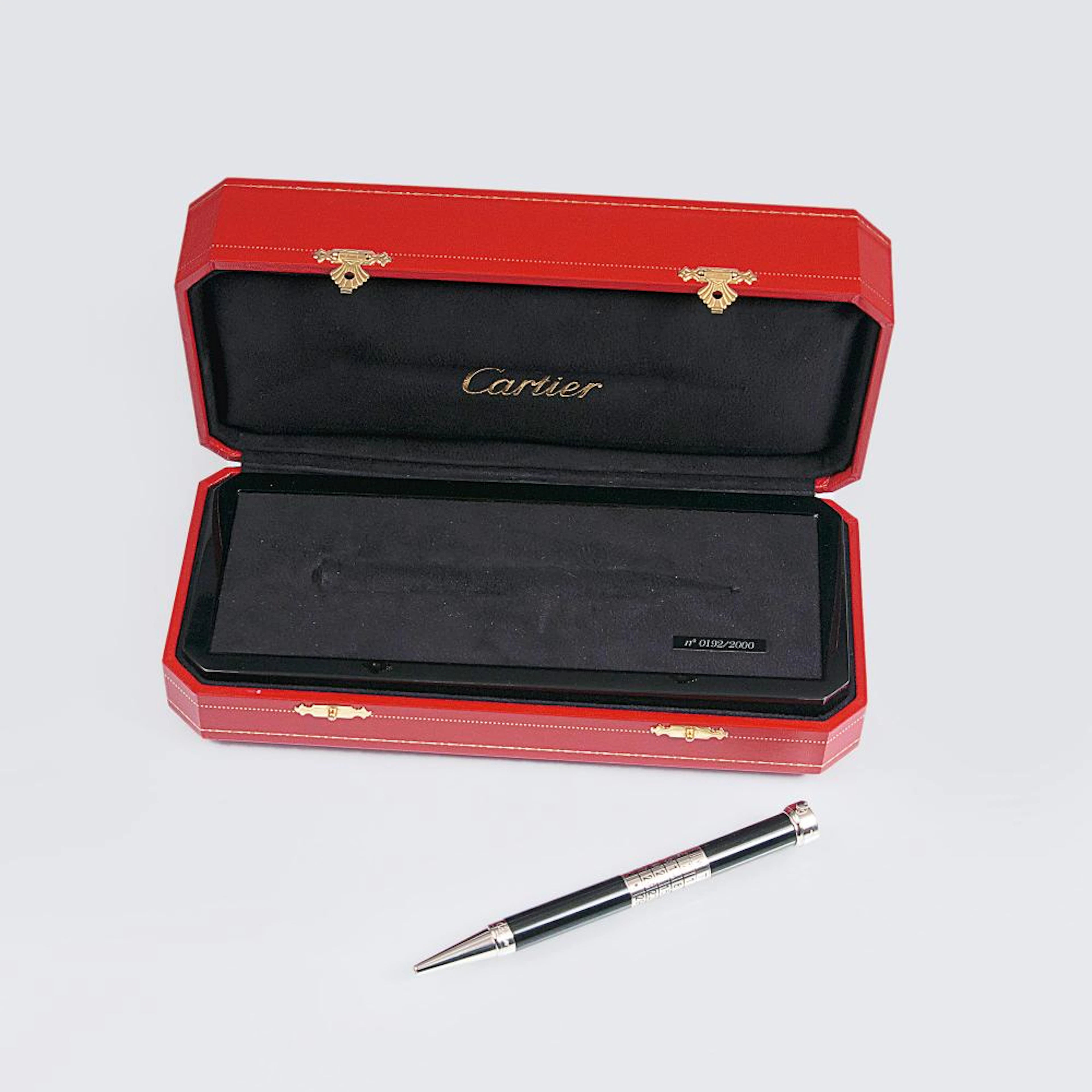 Cartier est. 1847 in Paris. A Ballpoint with clock and calendar.