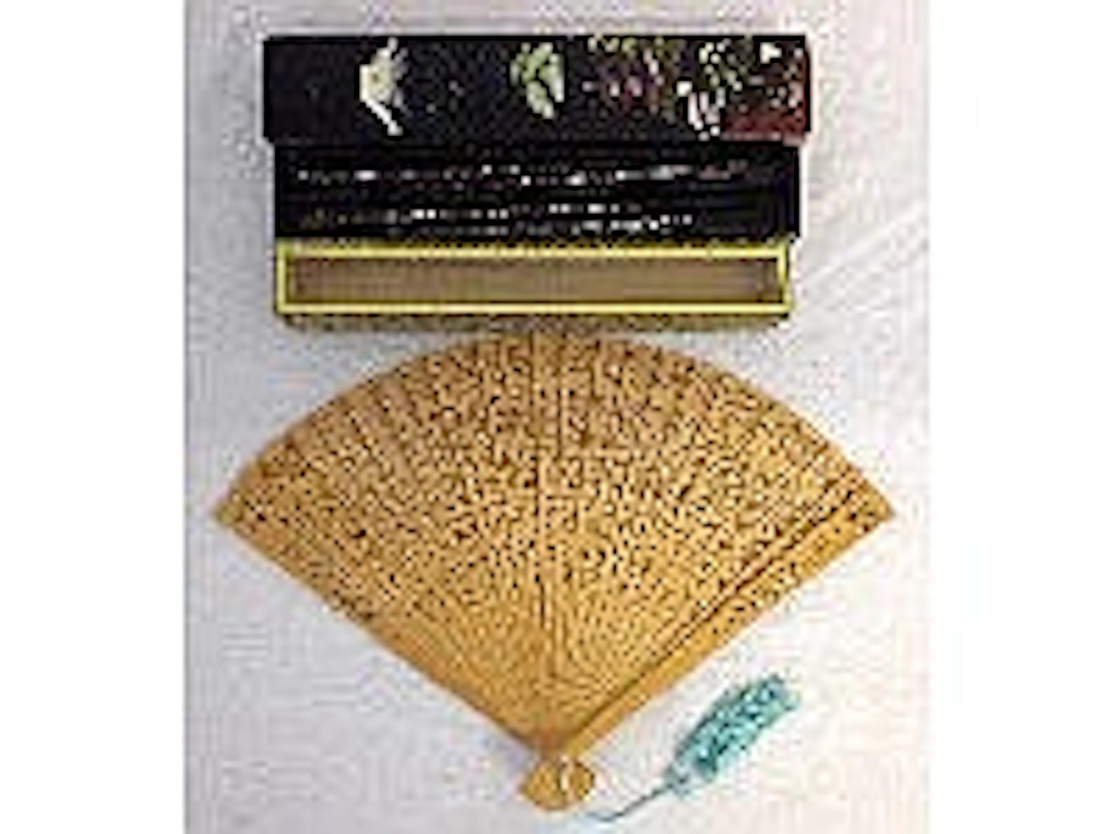 Oriental lacquer box with chop sticks and a fan