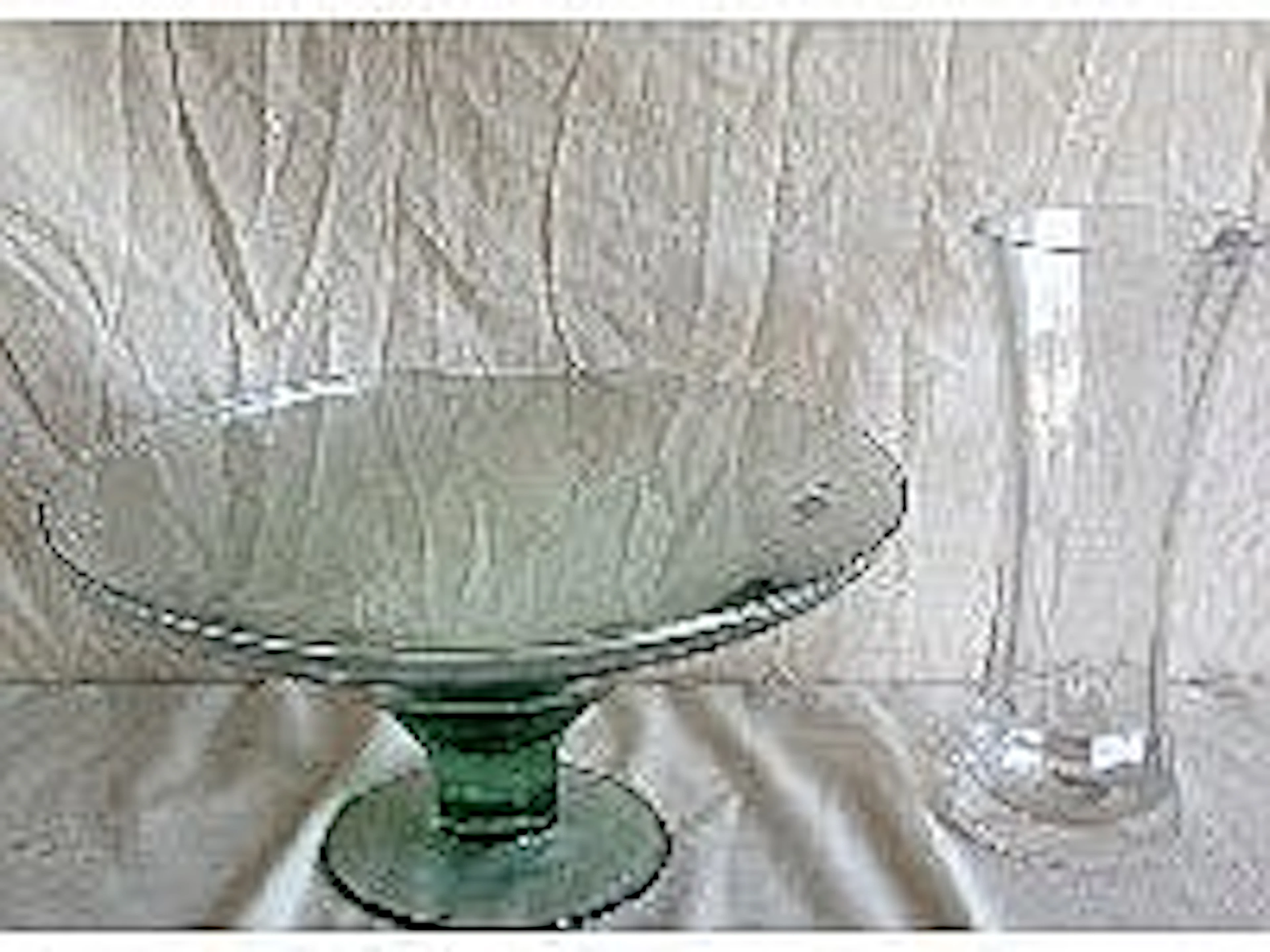 A large glass bowl and a vase