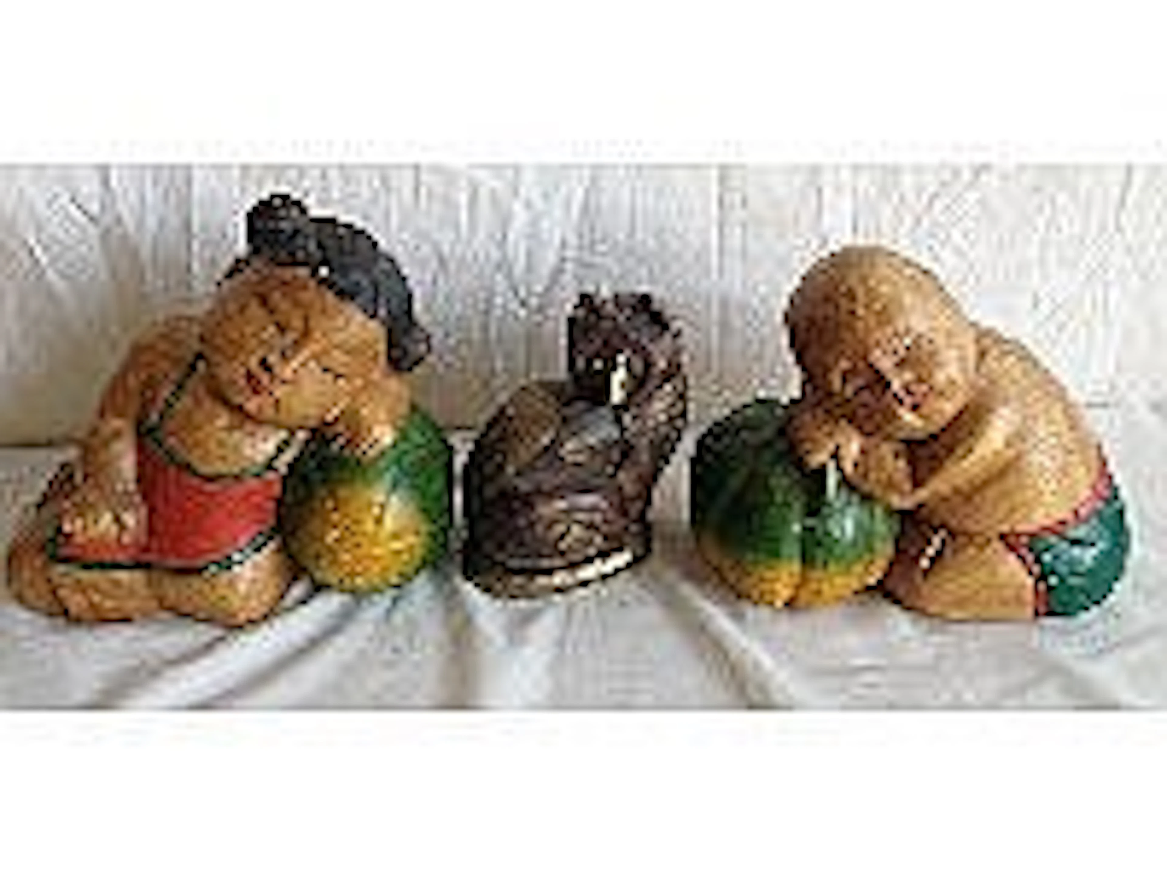 Three Oriental wooden figures - sleeping children