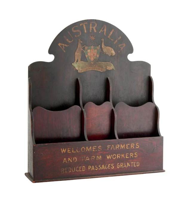 AN ANTIQUE STAINED OAK AND HARDWOOD PAMPHLET RACK Early 20th century