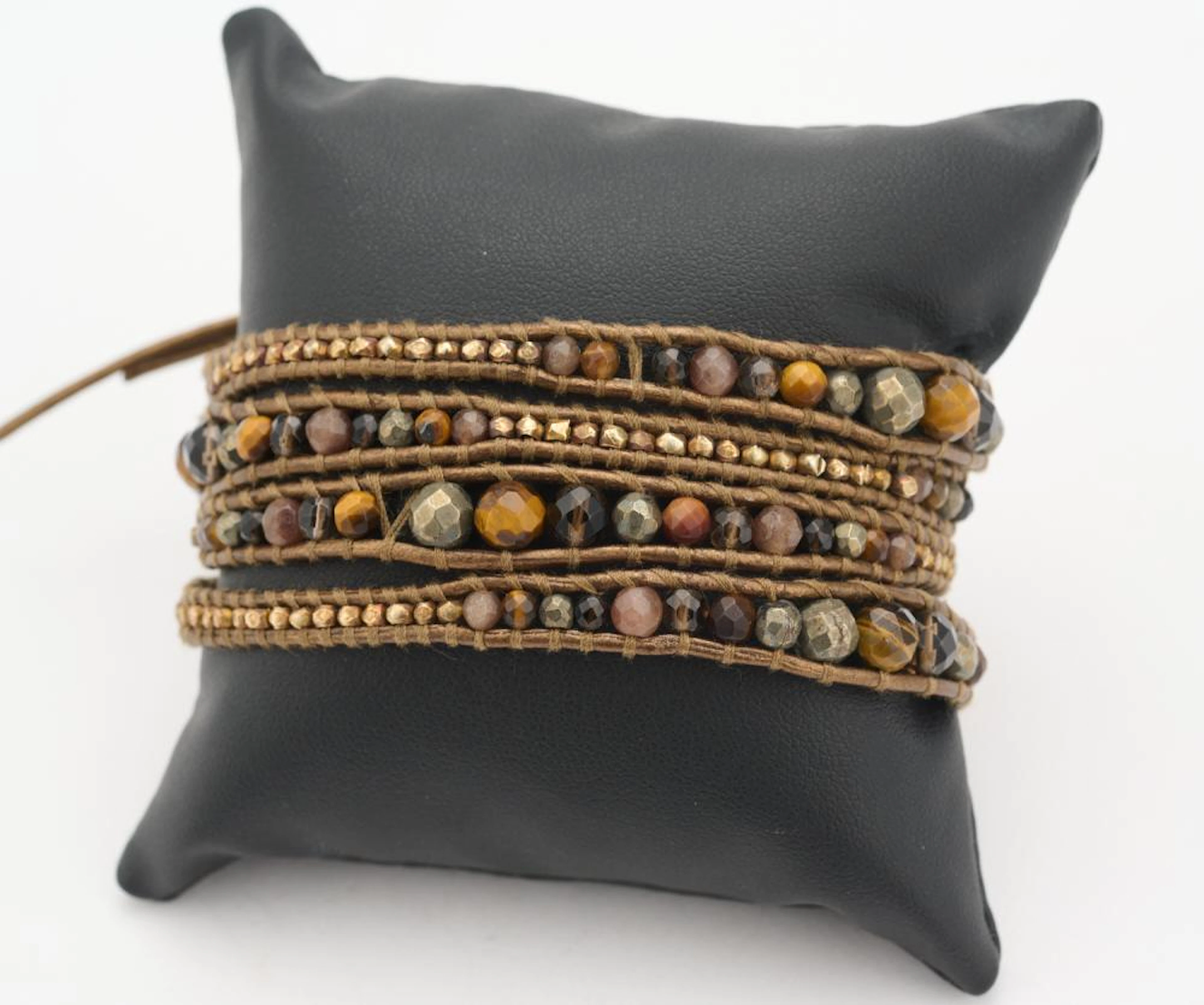 A TIGERS EYE BRACELET TOGETHER WITH AN AGATE SET BRACELET BY CHAN LUU