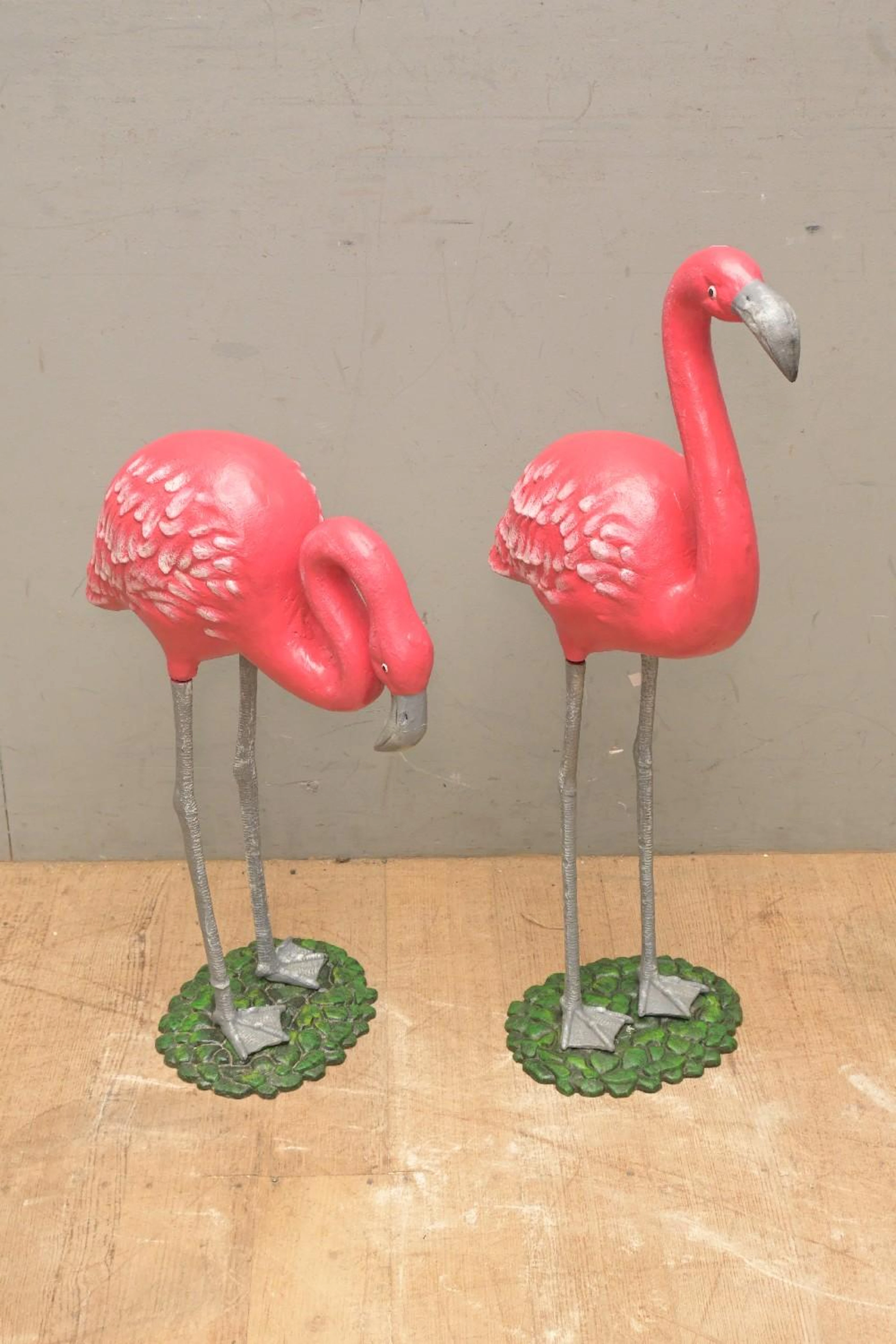 A PAIR OF CAST METAL FLAMINGO STATUES (74CM H) (LEONARD...