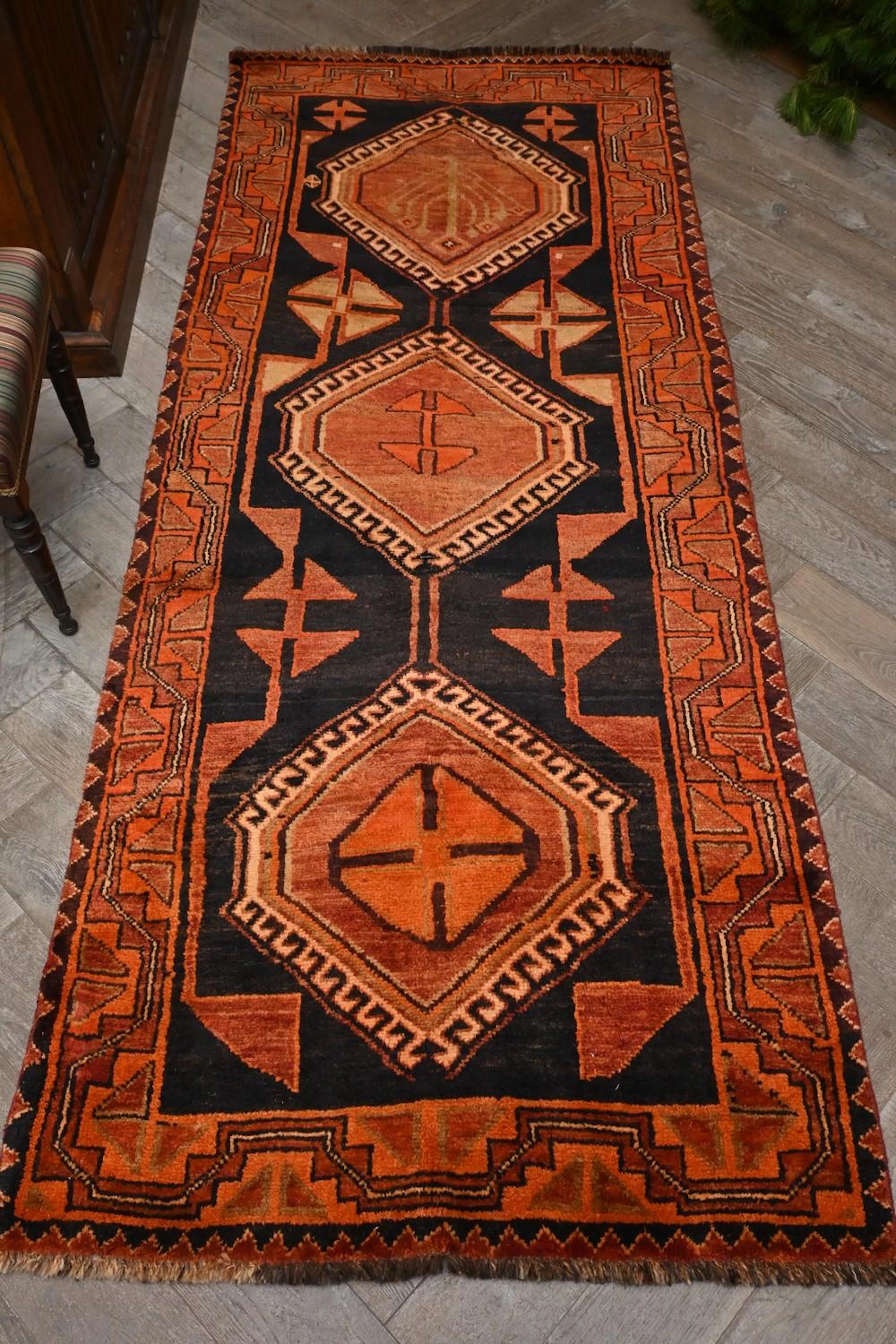 A SEMI ANTIQUE PERSIAN LURESTAN HALL RUNNER CIRCA 1960S...