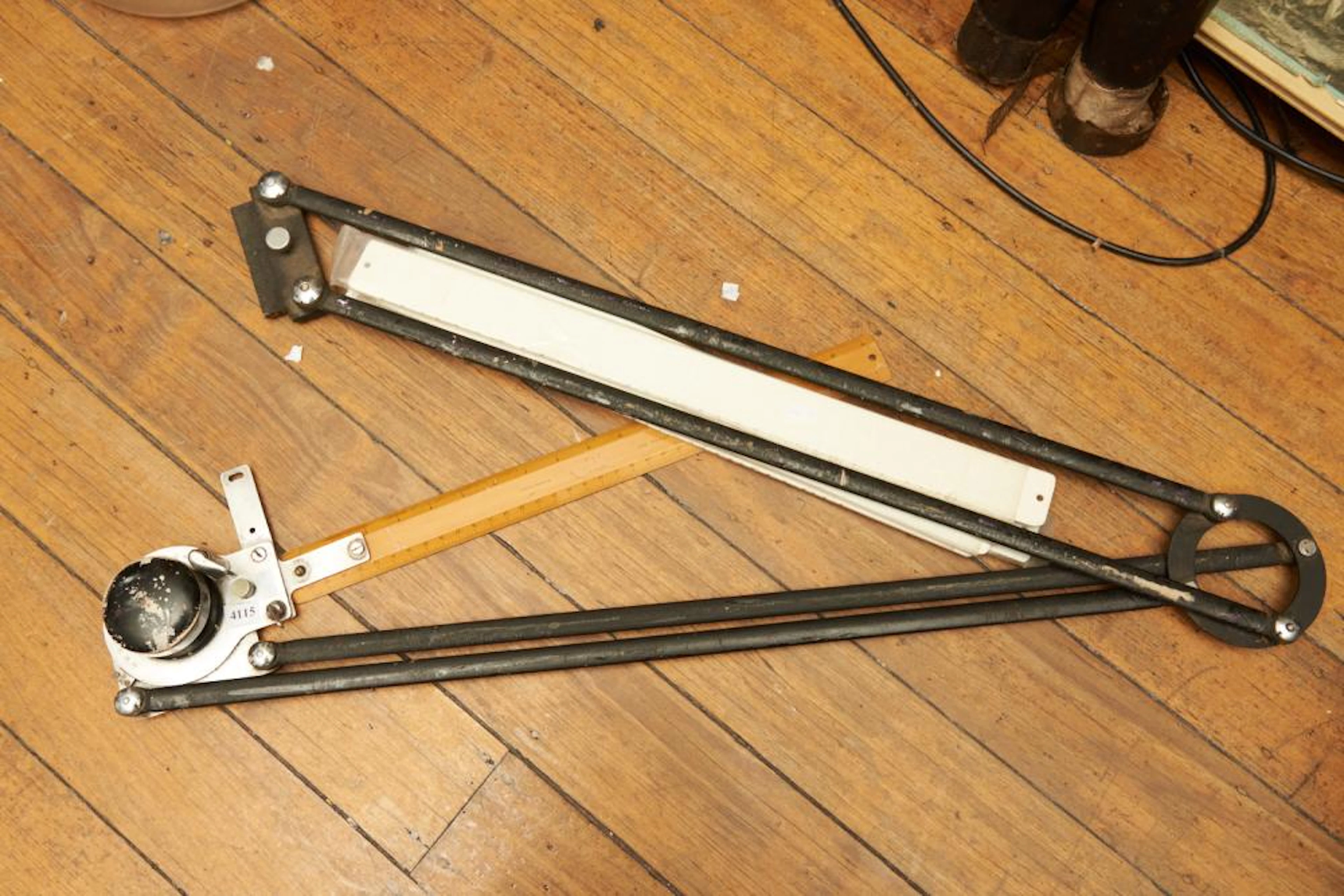 A VINTAGE WOODEN AND STEEL ARCHITECTURAL DRAWING TOOL AND...