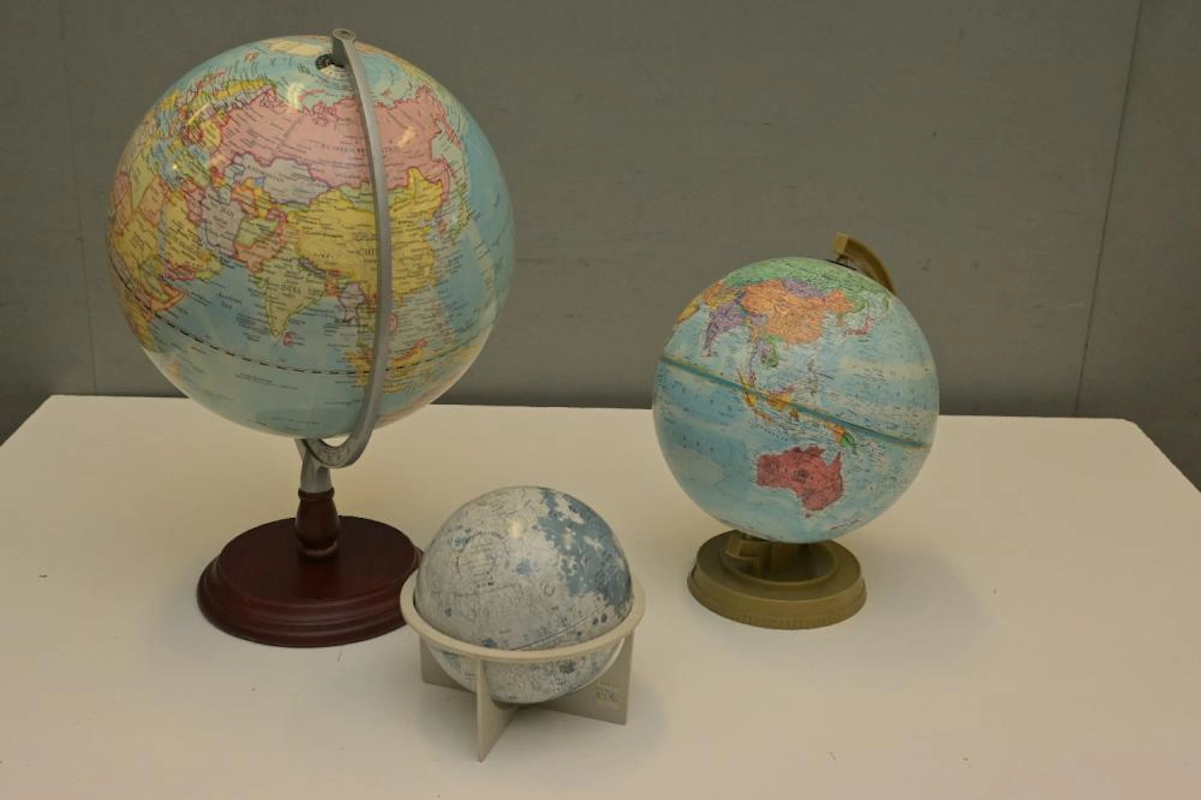 THREE OLD WORLD GLOBES INCLUDING REPLOGUE WORLD SCHOLAR...