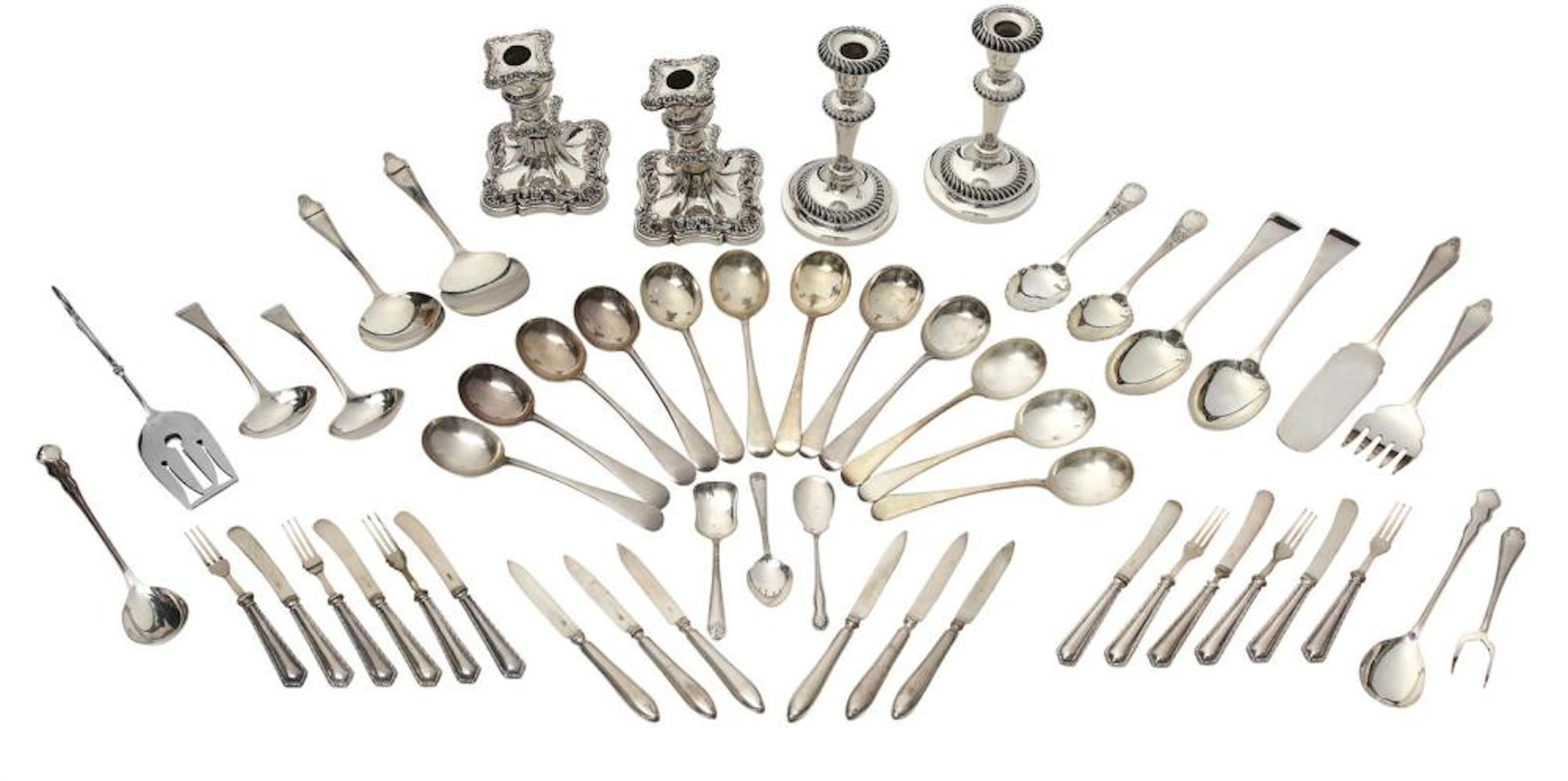 TWO PAIRS OF SILVERPLATED CANDELSTICKS AND A QUANTITY OF SERVING CUTLERY
