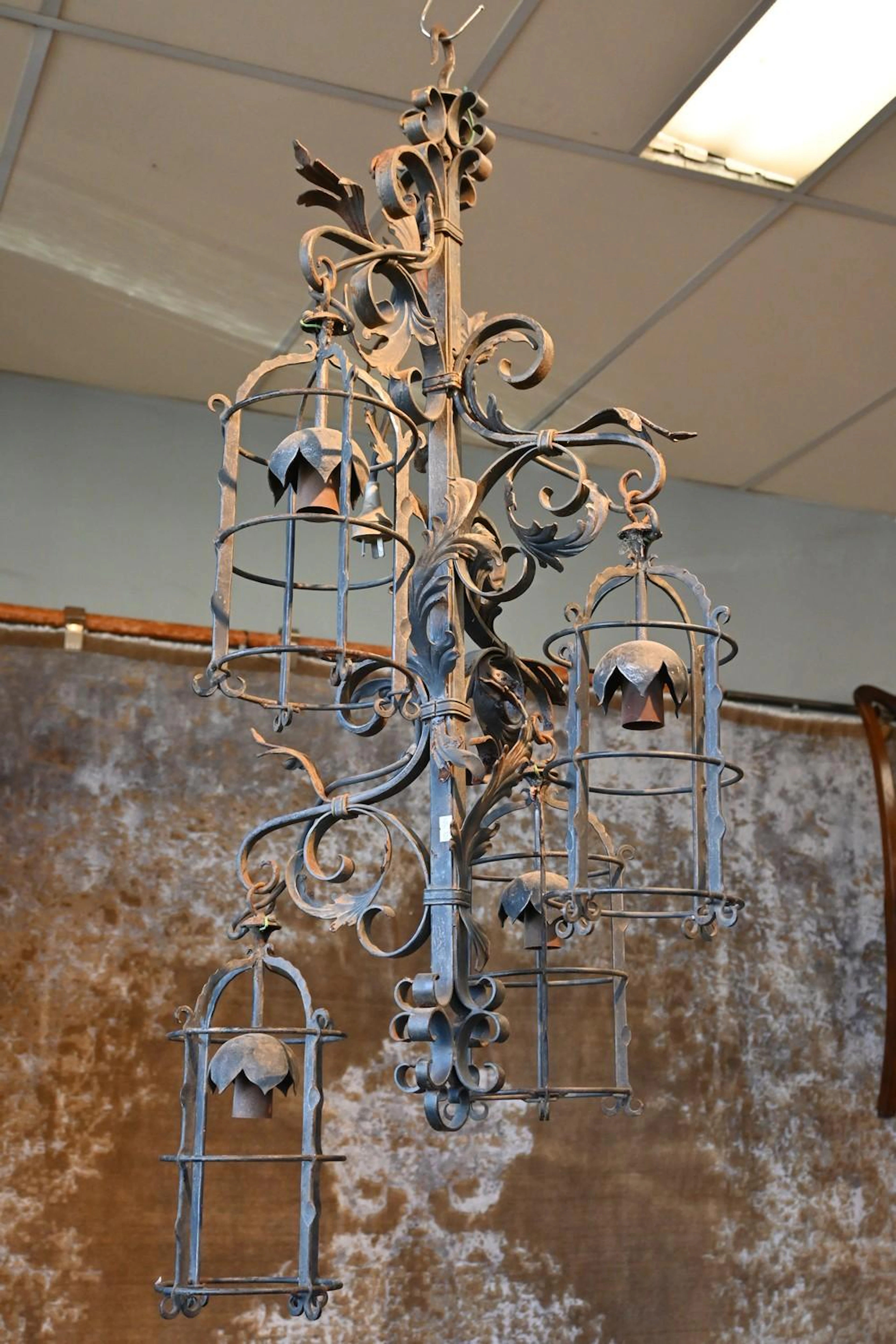 AN EARLY 20TH CENTURY FRENCH WROUGHT IRON FOUR BASKET...