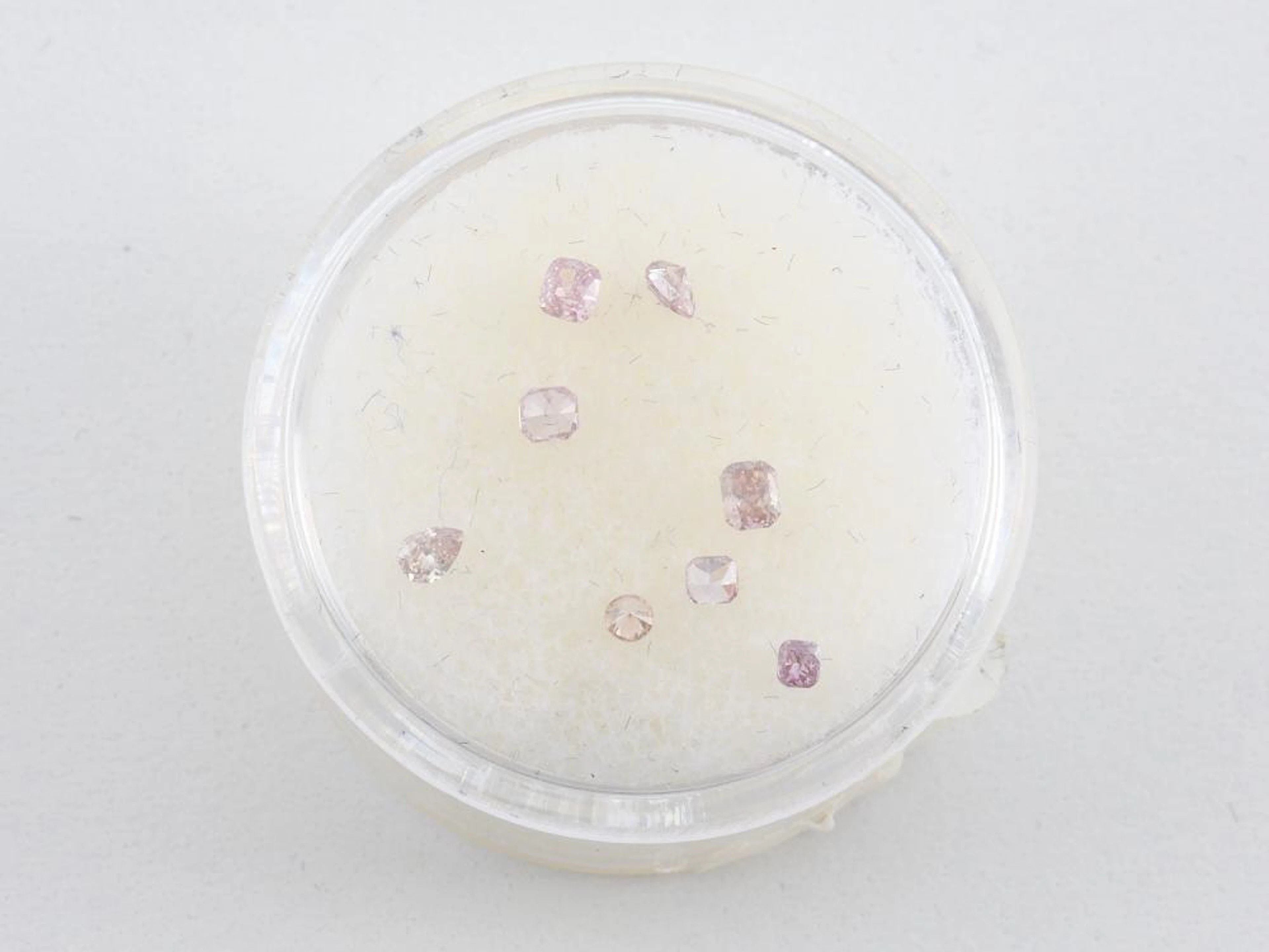 A COLLECTION OF LIGHT PINK DIAMONDS OF VARYING SIZE AND COLOUR
