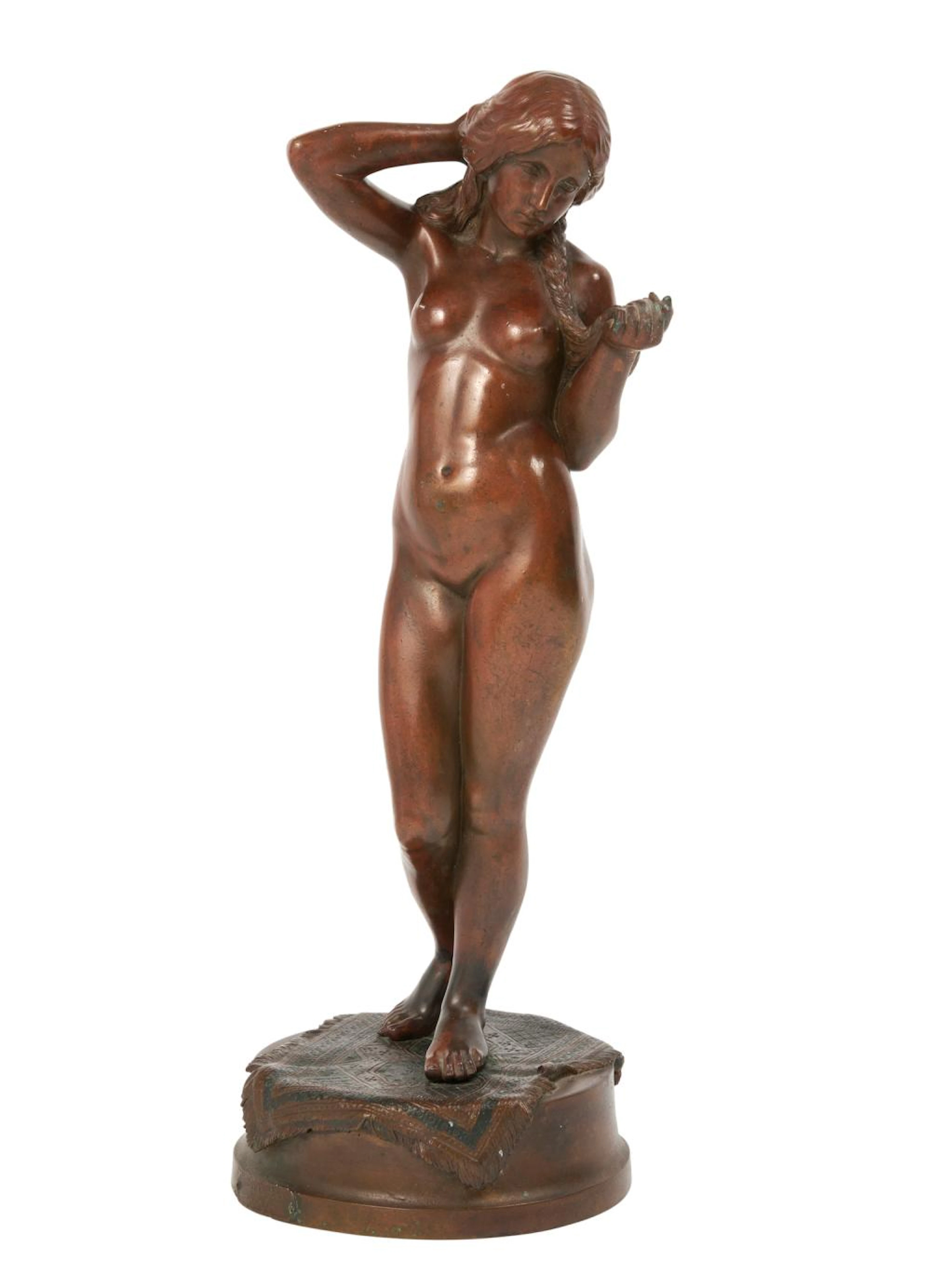 A VIENNESE PATINATED BRONZE FIGURE OF A FEMALE NUDE In...