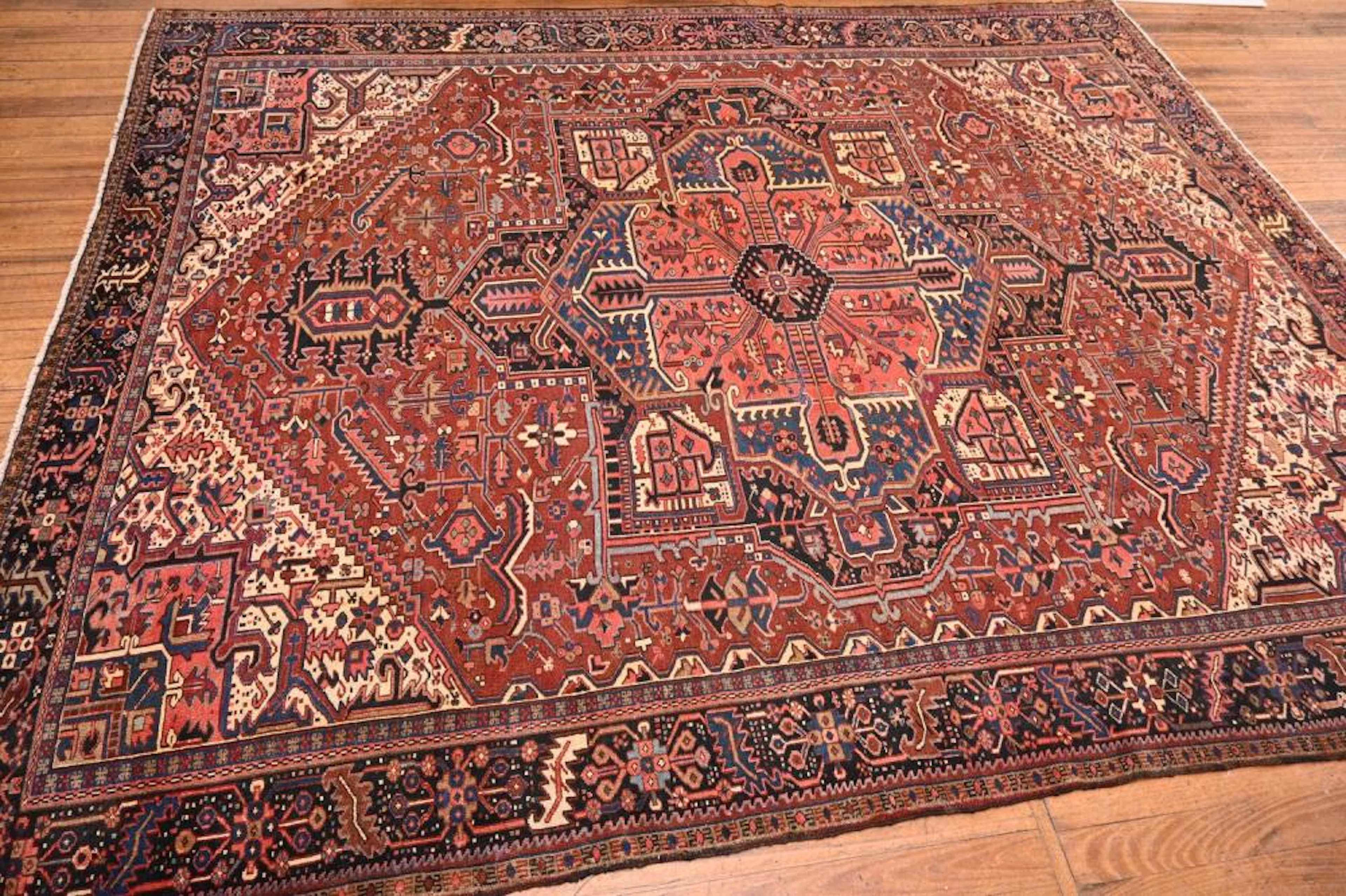 AN ORIGINAL ANTIQUE HERIZ CARPET EX-GALLERY CARPET