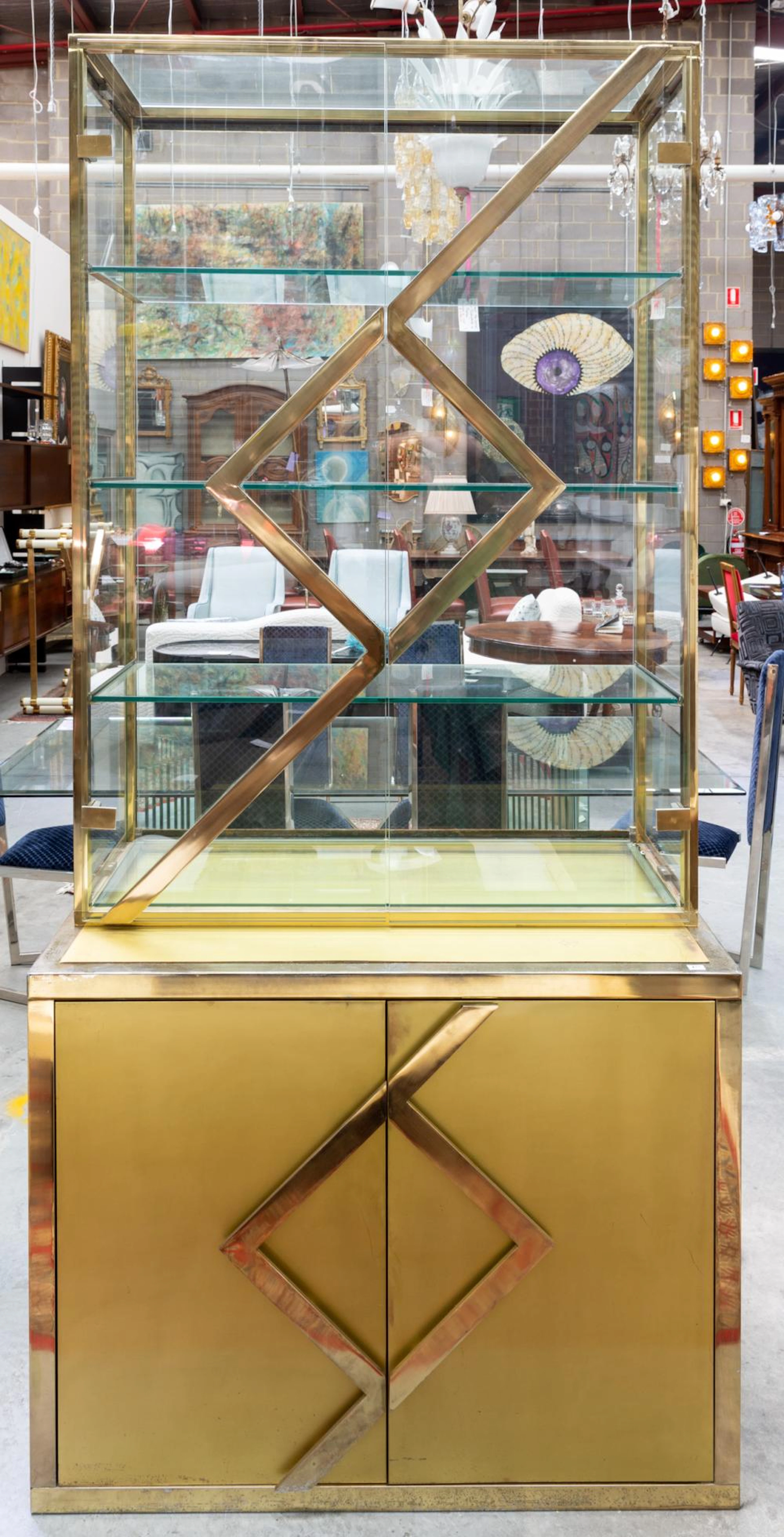 A FRENCH MODERNIST BRASS AND GLASS CABINET BY MAISON JANSE
