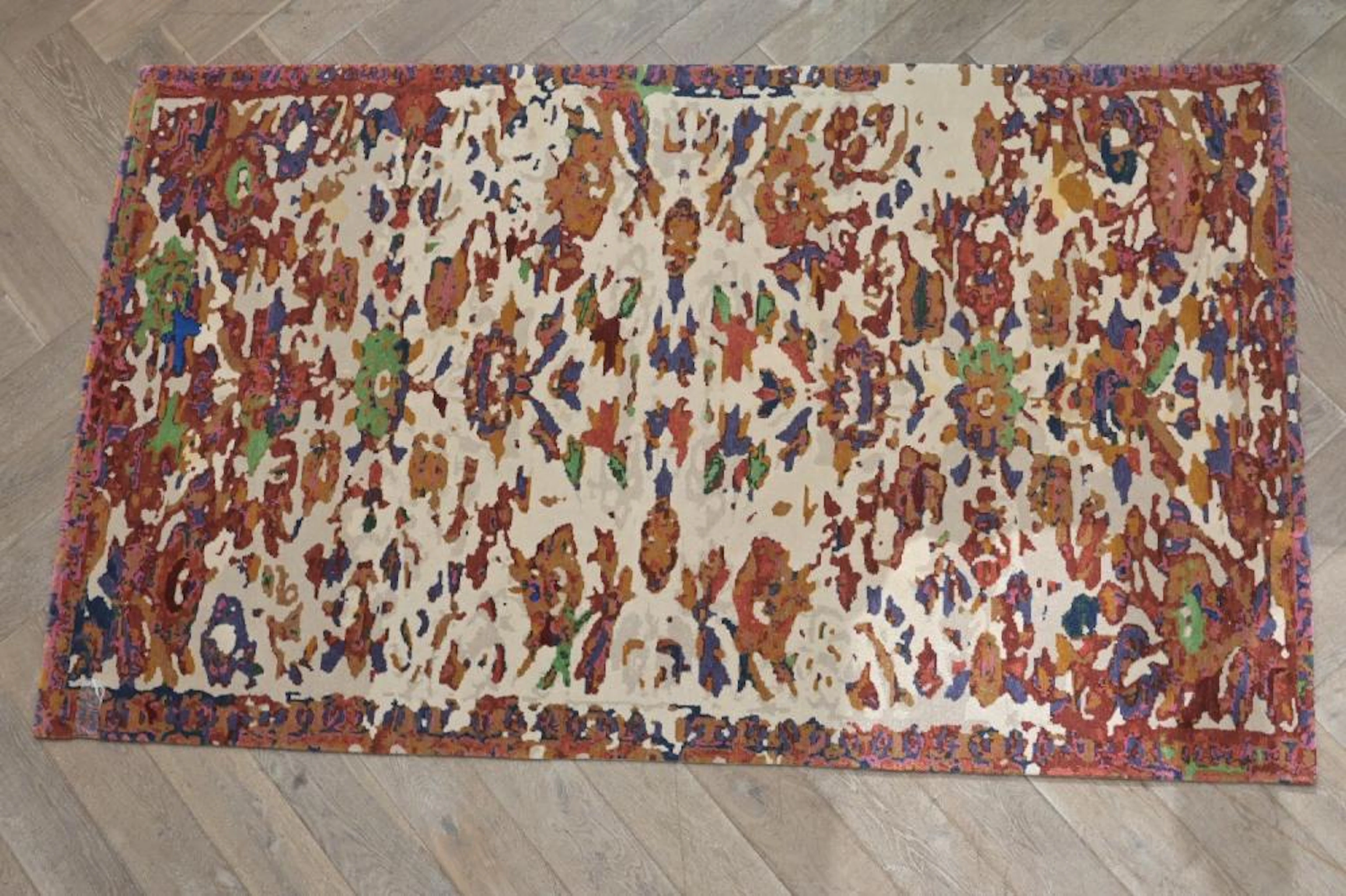 A CONTEMPORARY HAND WOVEN TIBETAN RUG WOVEN IN NEPAL