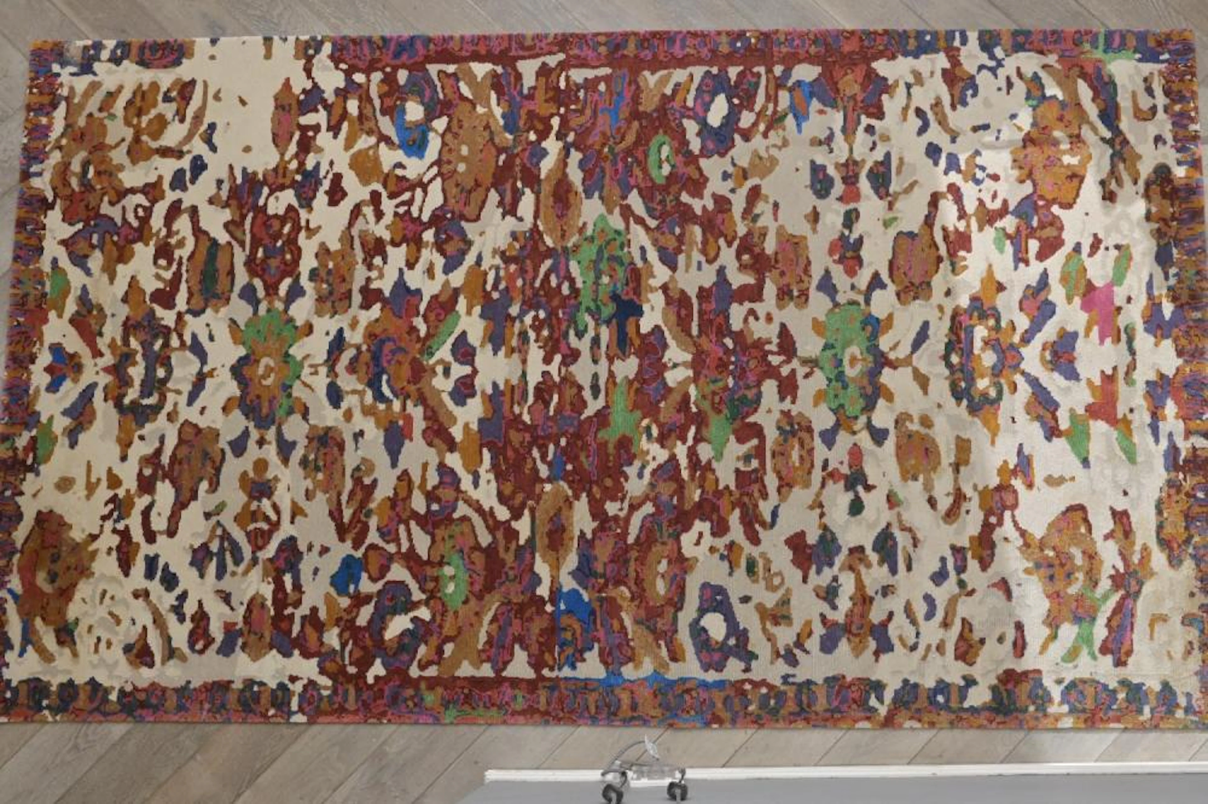 A CONTEMPORARY HAND WOVEN TIBETAN RUG WOVEN IN NEPAL