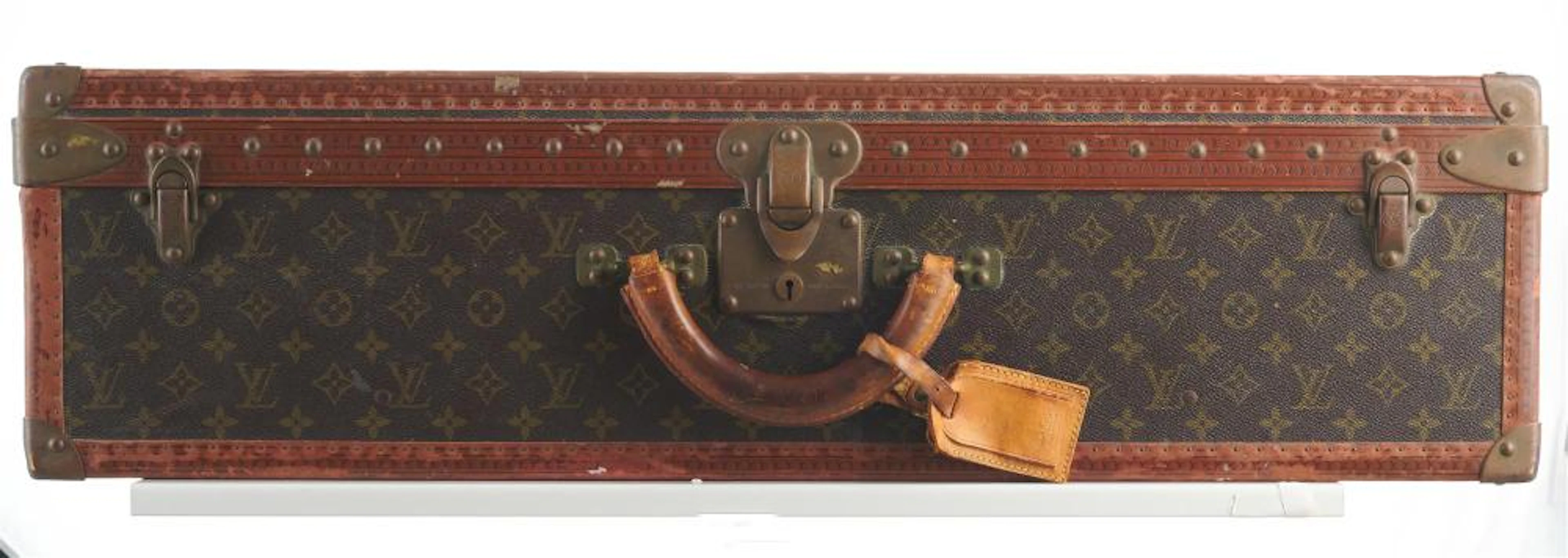 AN ALZER HARD SUITCASE WITH REMOVABLE INNER TRAY BY LOUIS VUITTO