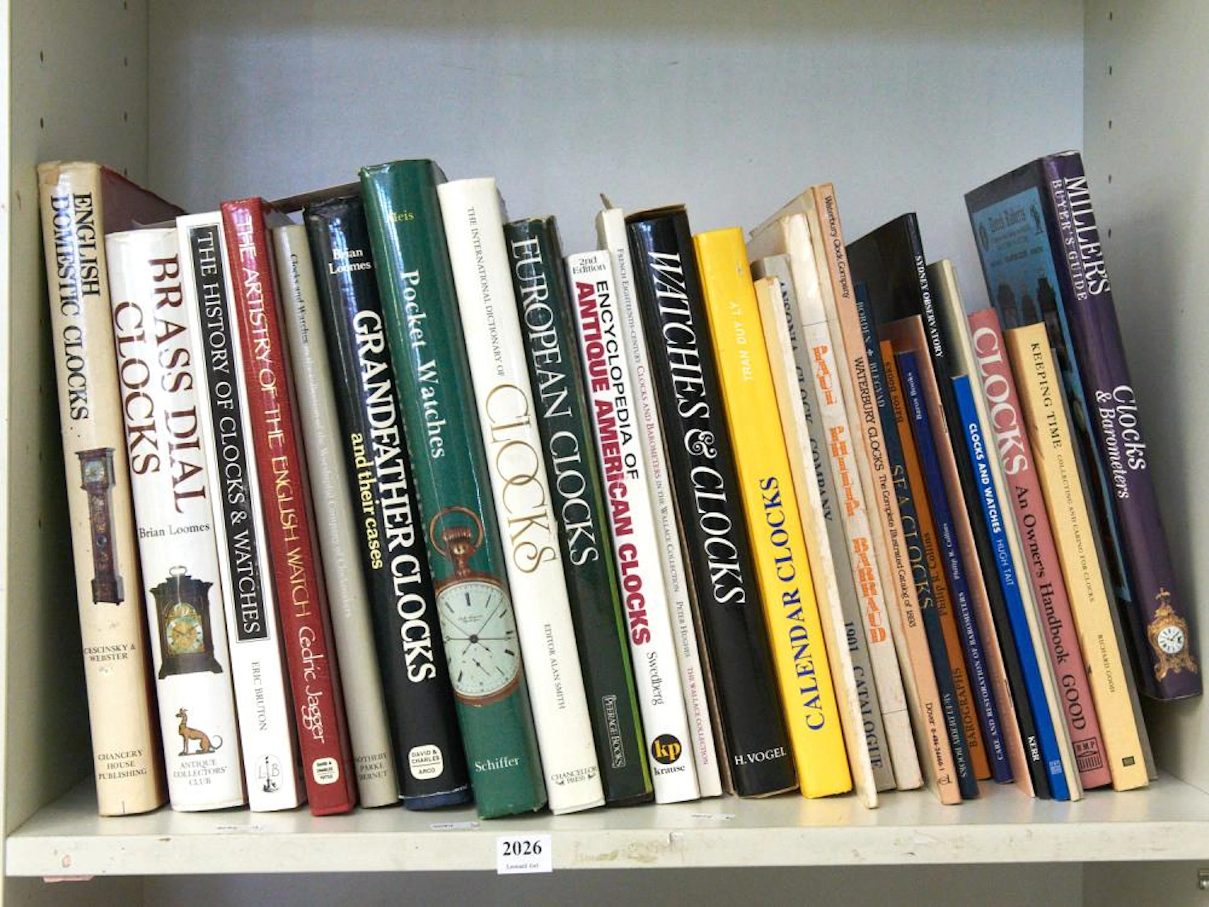 A SHELF OF REFERENCE BOOKS ON HOROLOGY INCLUDING ENGLISH DOMESTIC CLOCKS