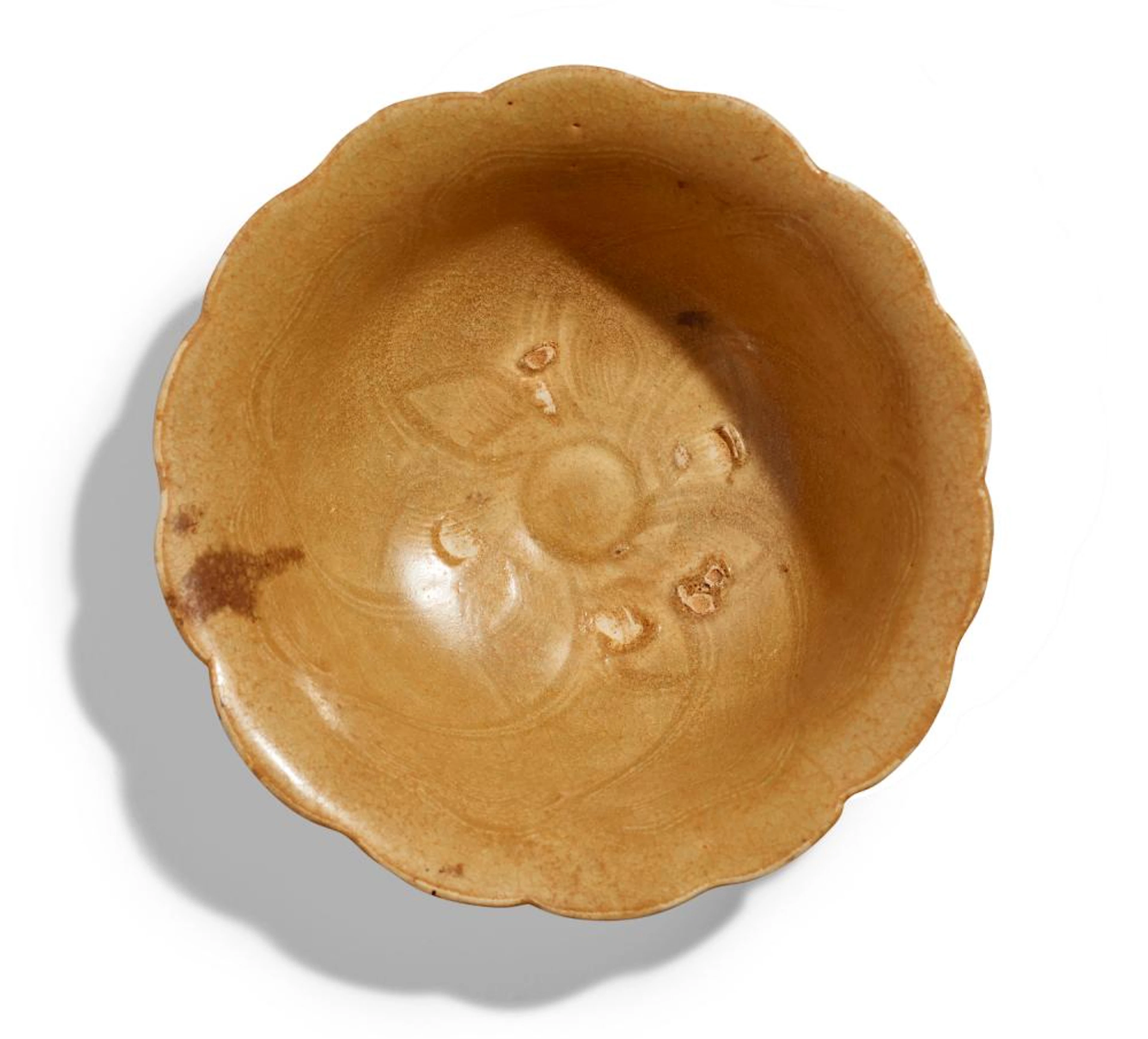A VIETNAMESE MOULDED MALLOW-FORM GOLDEN CELADON BOWL