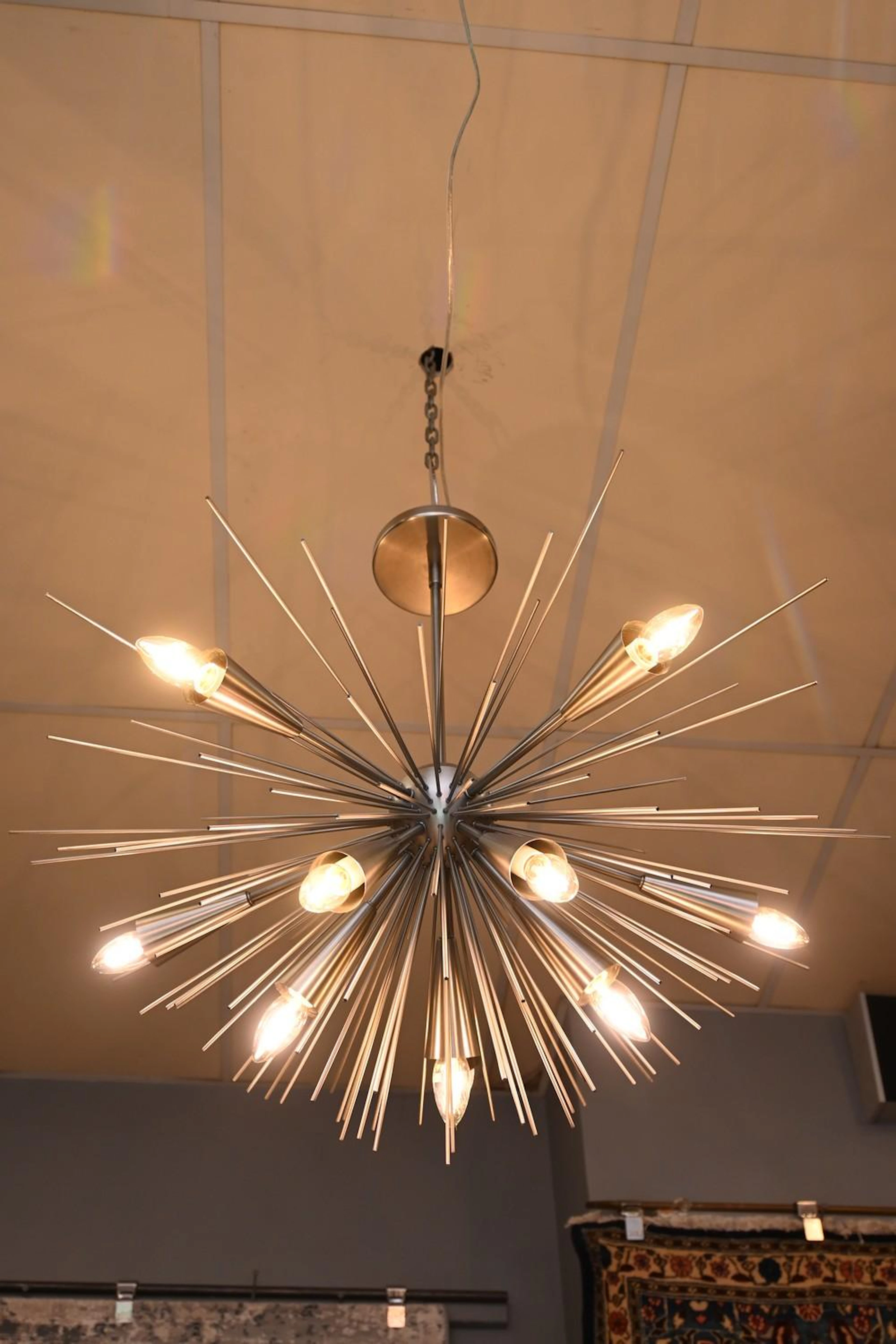 A MODERN CONTEMPORARY TEN BRANCH SPUTNIK CHANDELIER (80H...