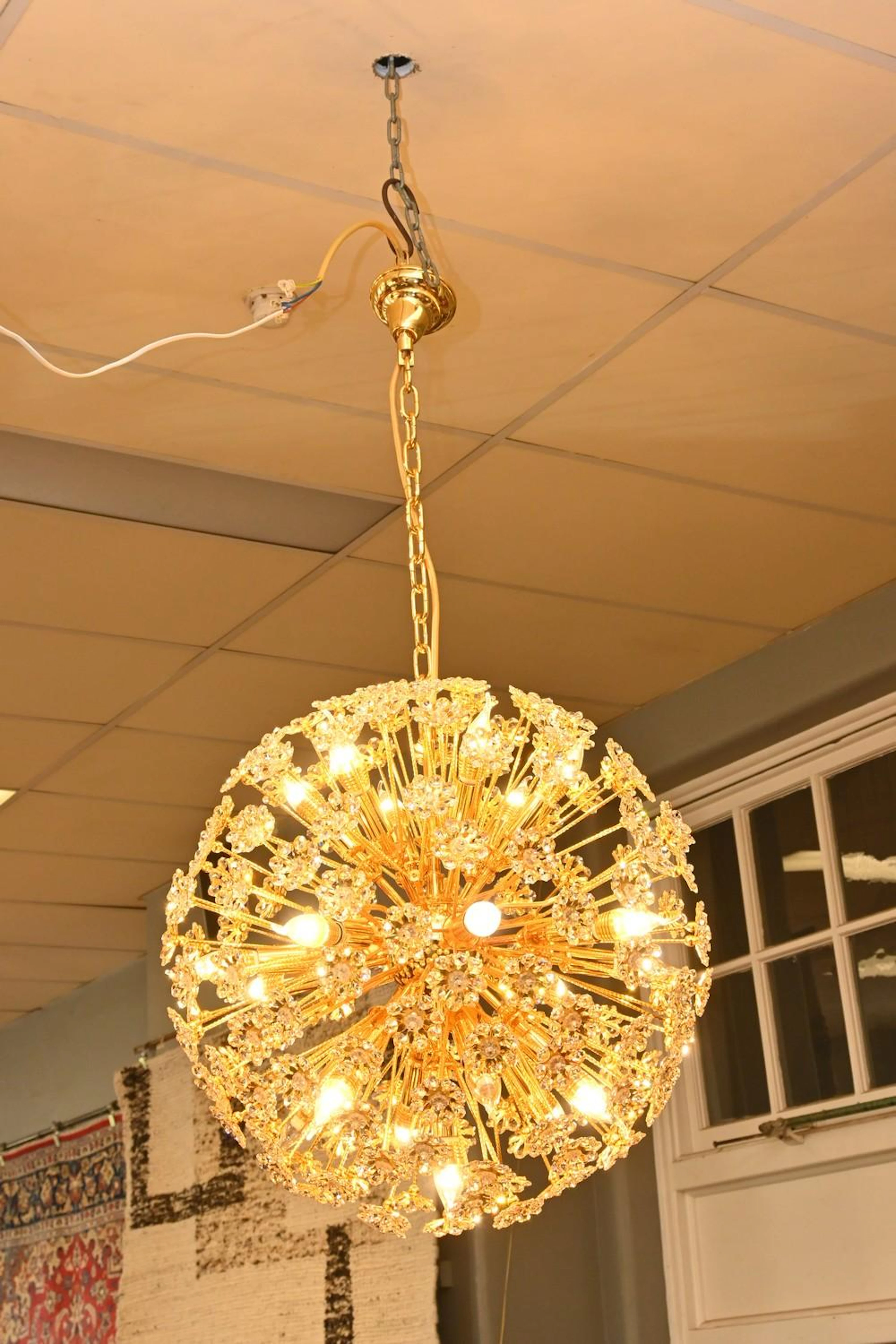 A GOLD FLOWER SPUTNIK CRYSTAL CHANDELIER (70CM D) (PLEASE...