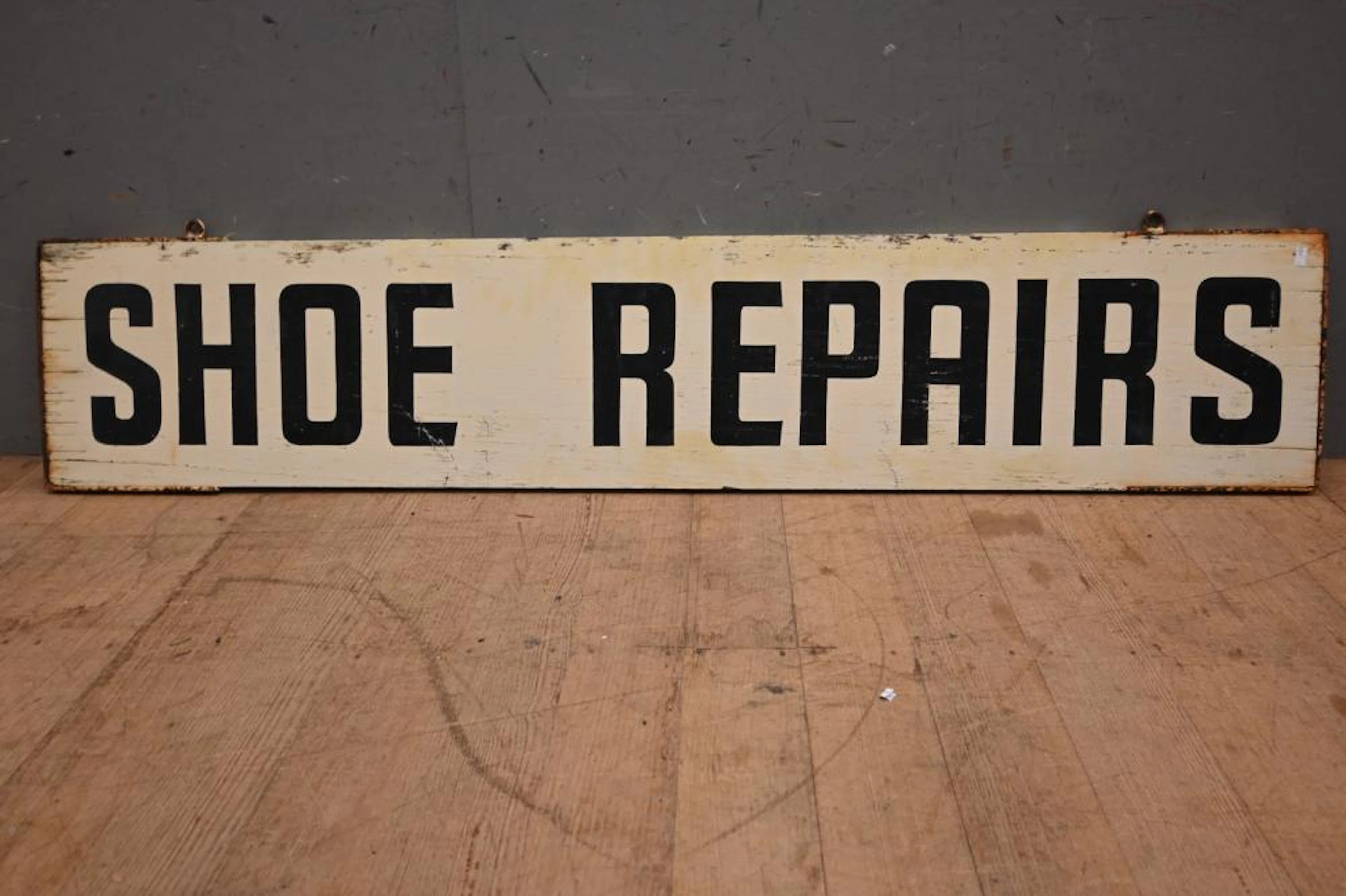 A VINTAGE SHOE REPAIRS SWINGING SIGN (31H X 154W CM)...