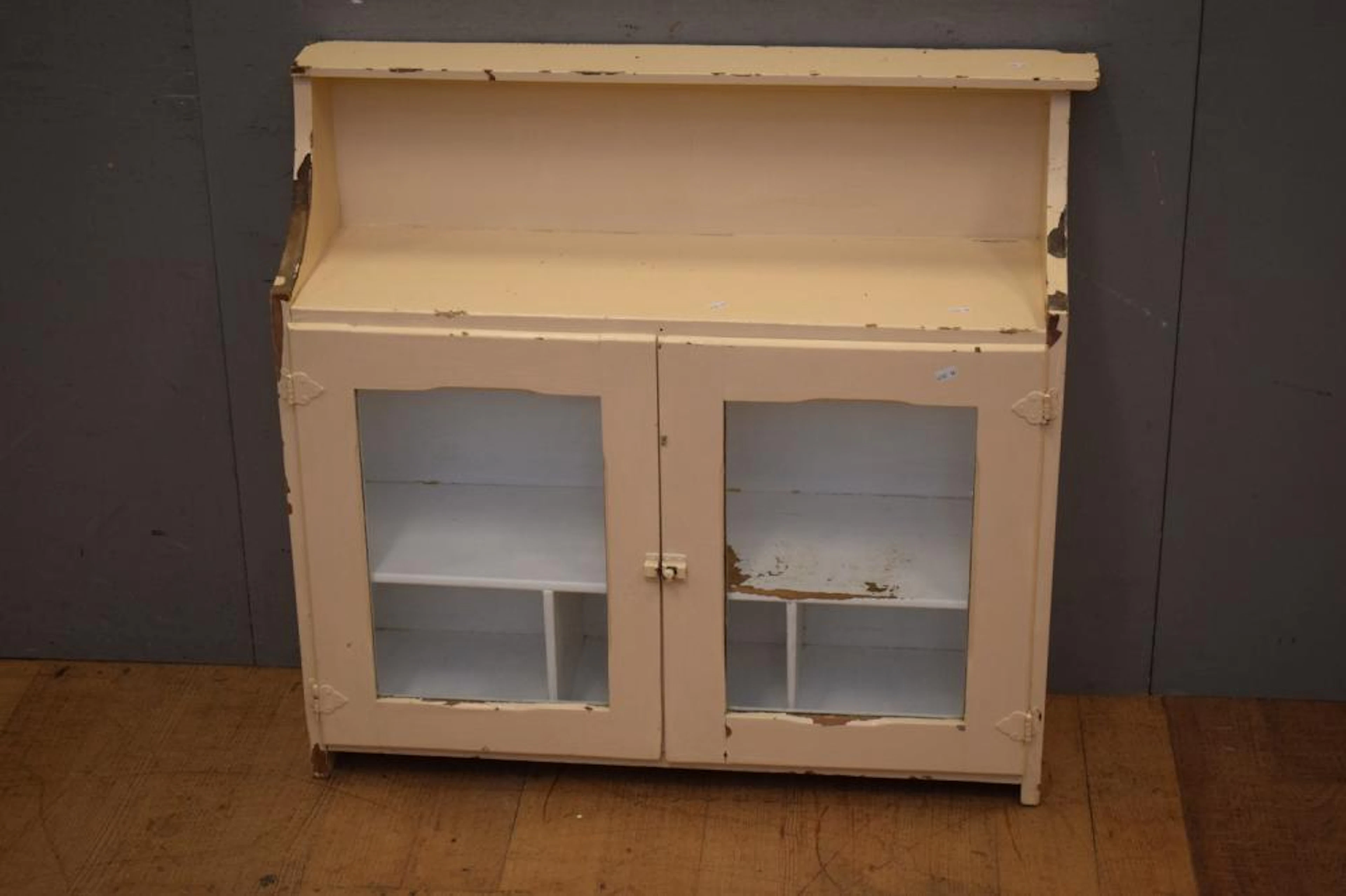 A DEPRESSION PAINTED WOODEN HANGING SHELVING UNIT WITH...