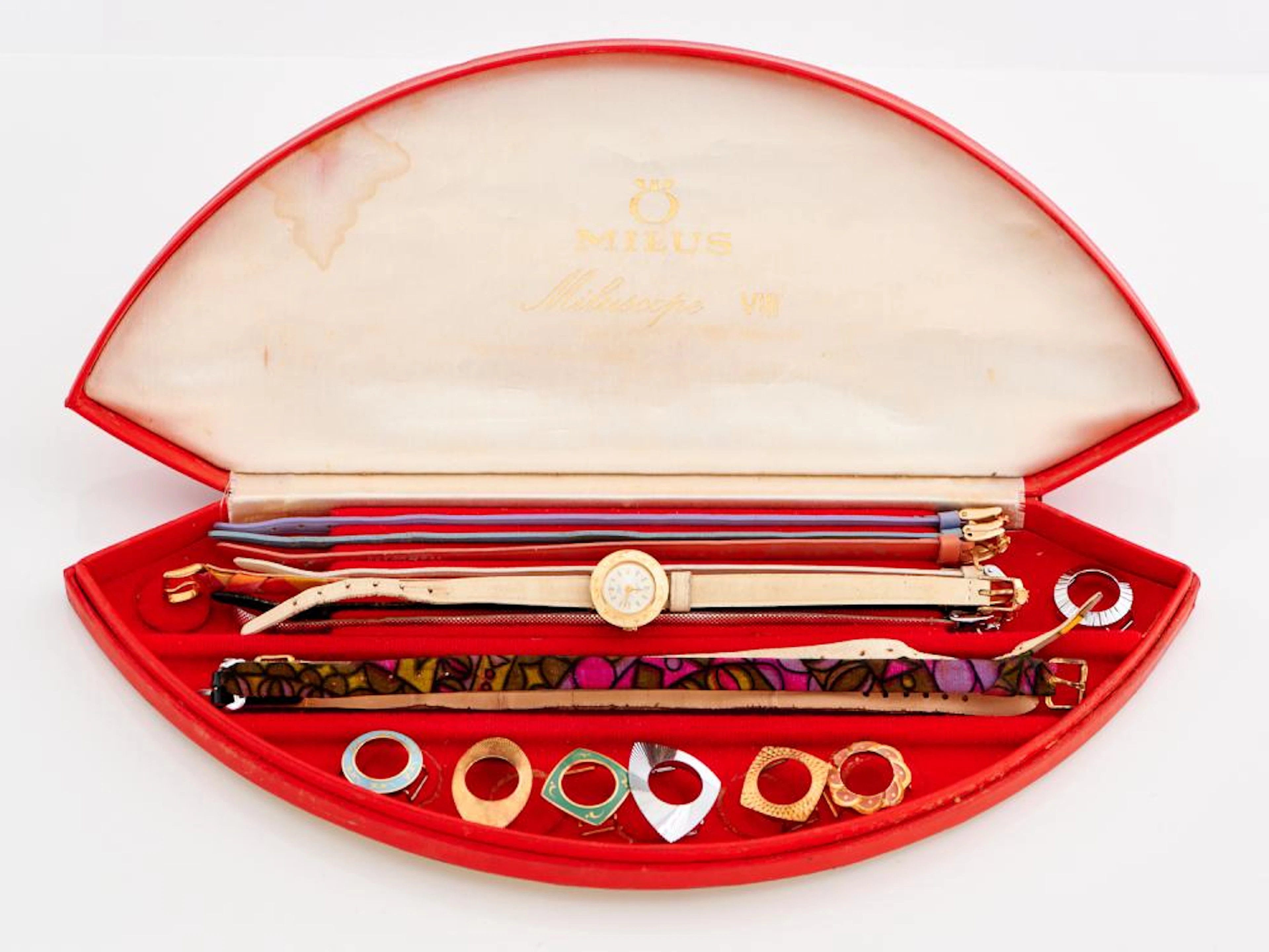 MILUS, A WRIST WATCH WITH VARIOUS STRAPS AND BEZELS, BOXED
