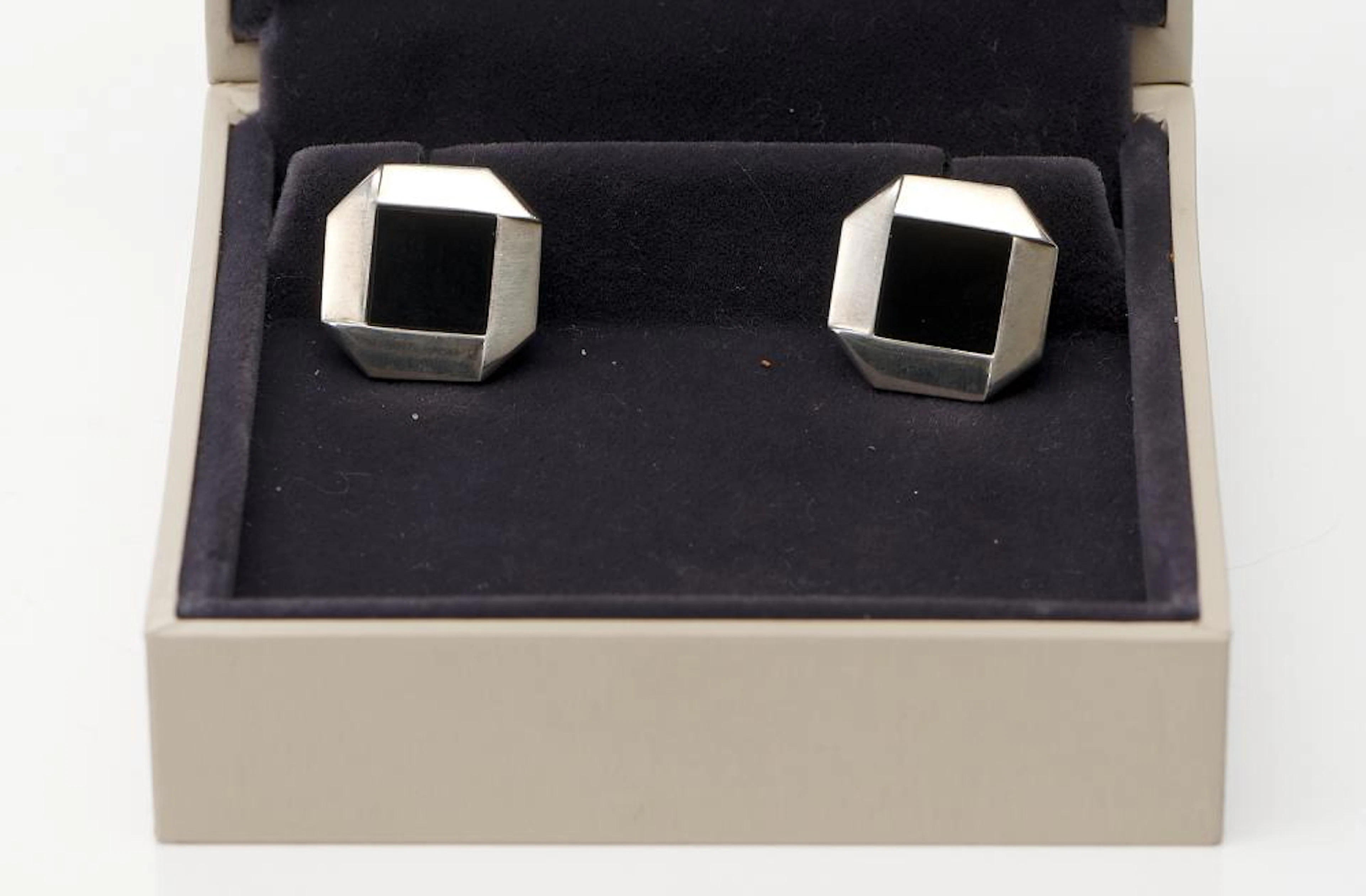 A PAIR OF ONYX SET CUFFLINKS BY GEORG JENSEN IN STERLING SILVER