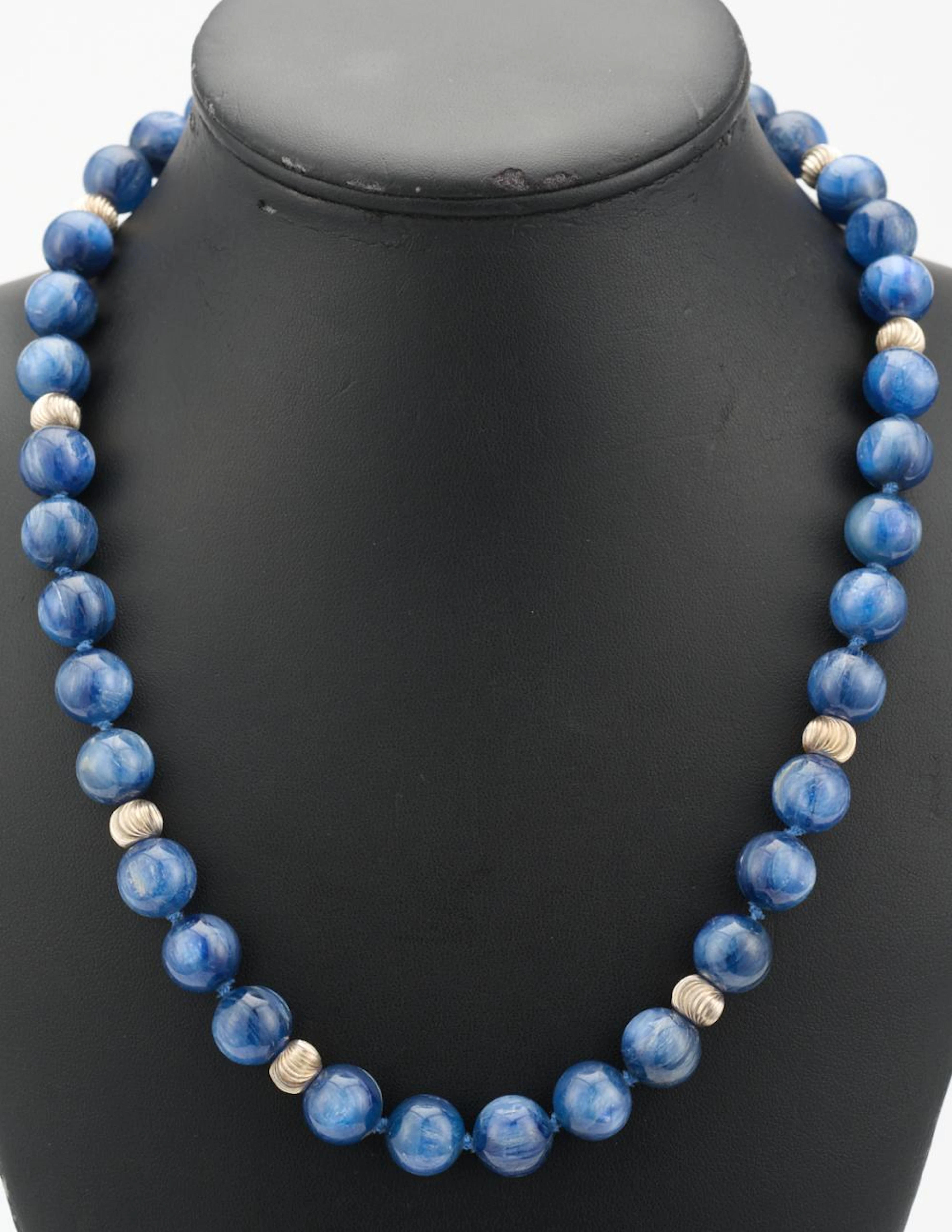 A STRAND OF KYANITE BEADS TO A MAGNETIC CLASP WITH A MATCHING BRACELET