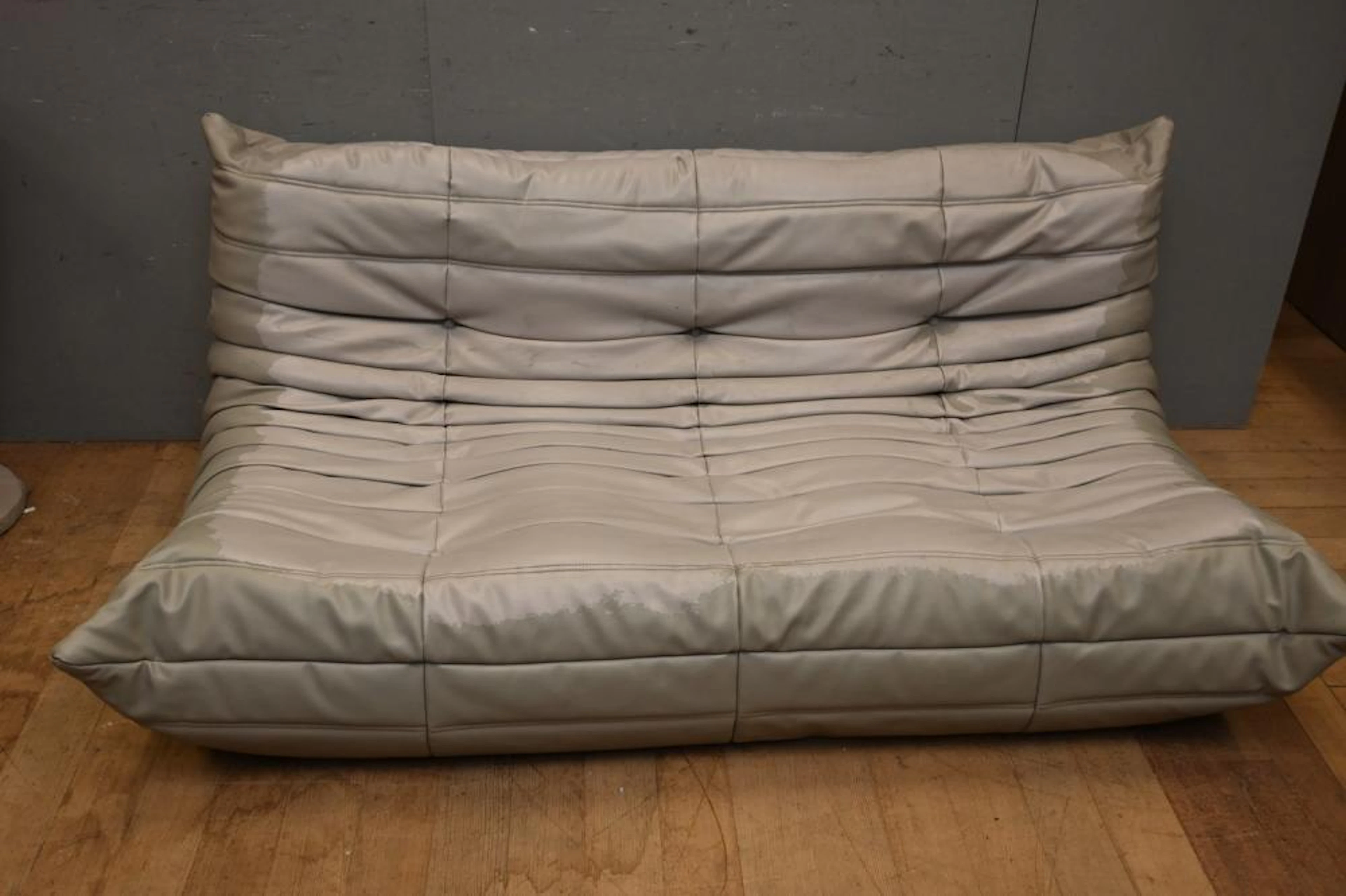 A MID CENTURY LIGNE ROSET TOGO TWO SEATER SOFA (A/F) (76H...