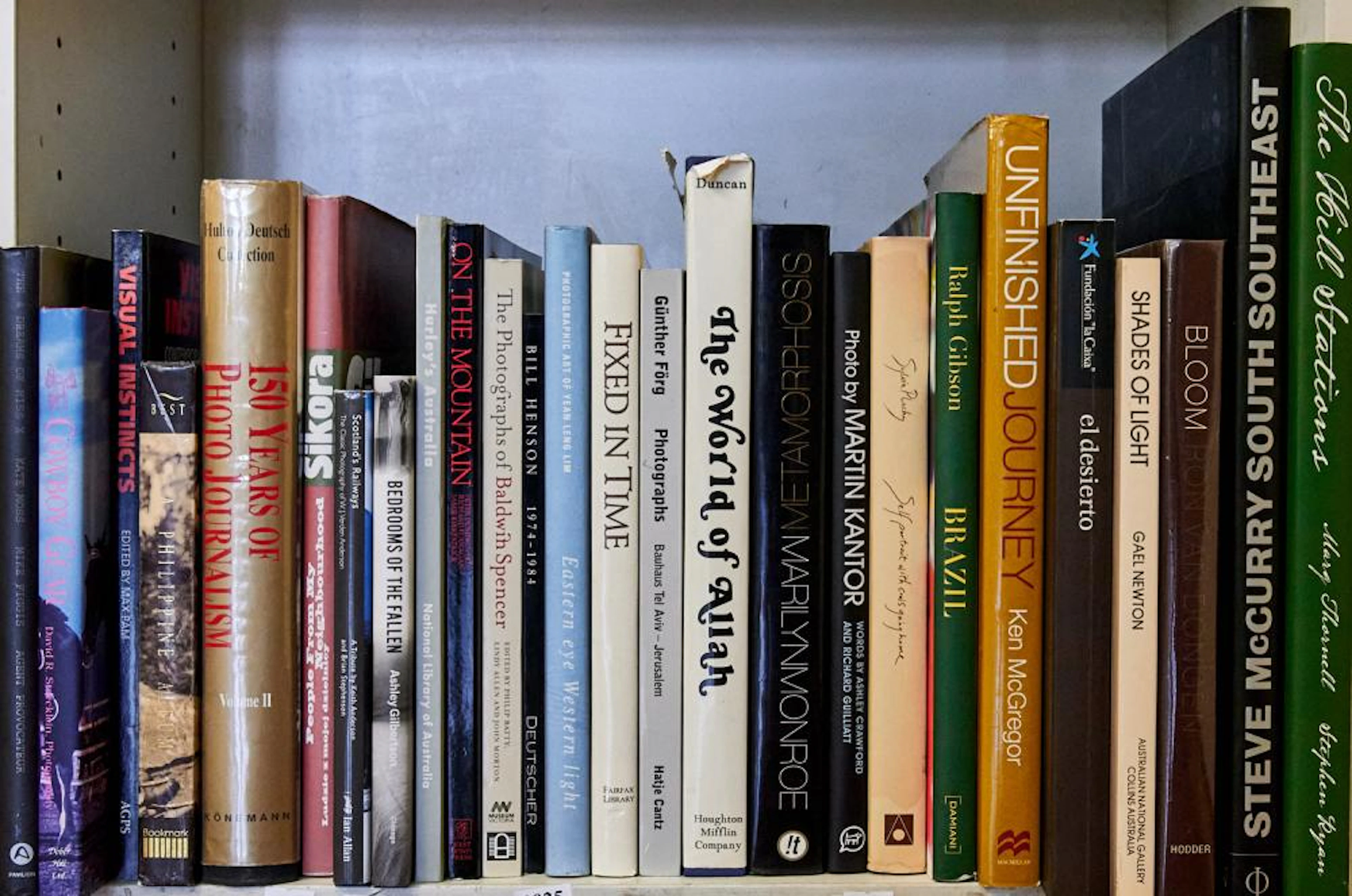 A SHELF OF PHOTOGRAPHY REFERNESCE INCLUDING RALPH GIBSON