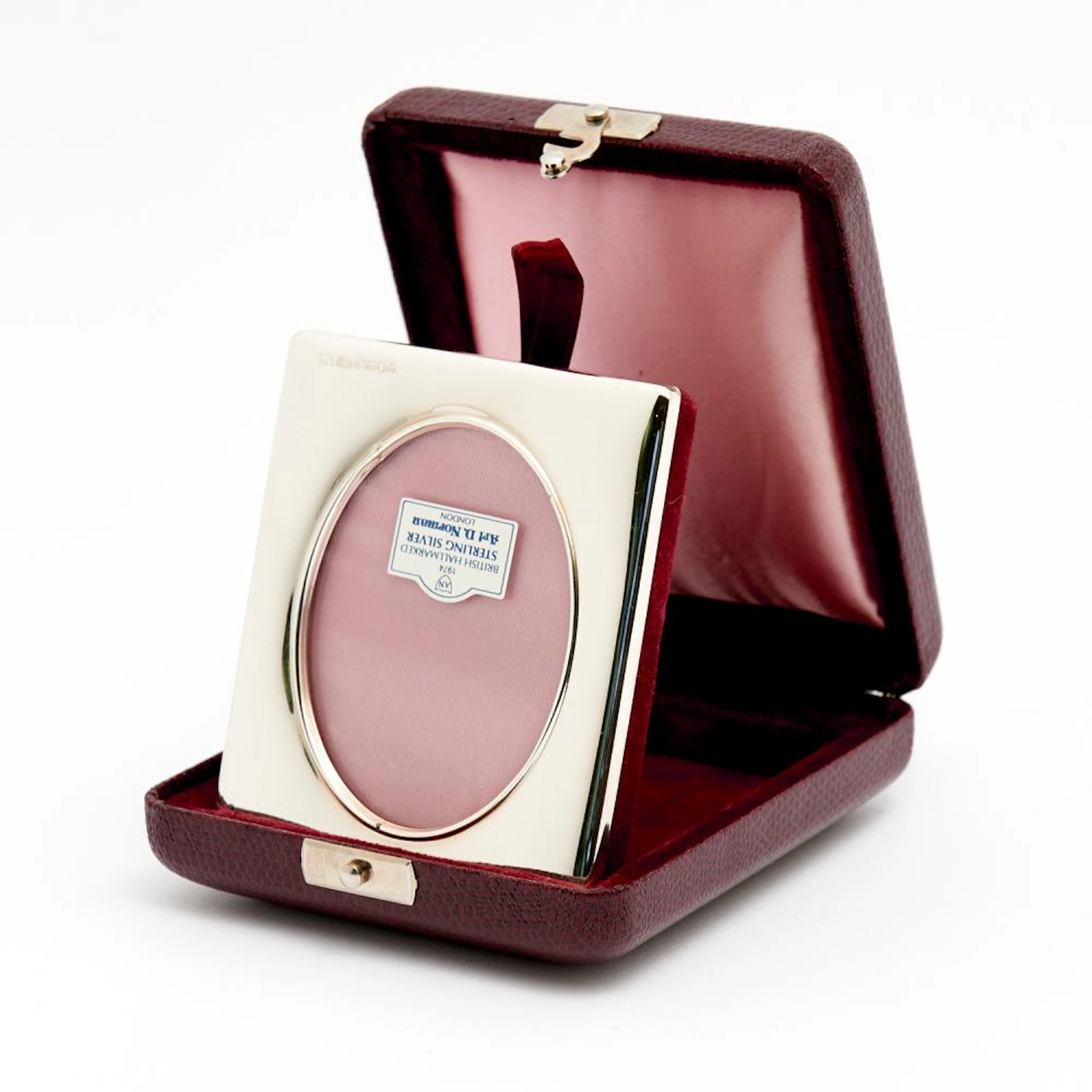 A STERLING SILVER PHOTO FRAME BY ART D